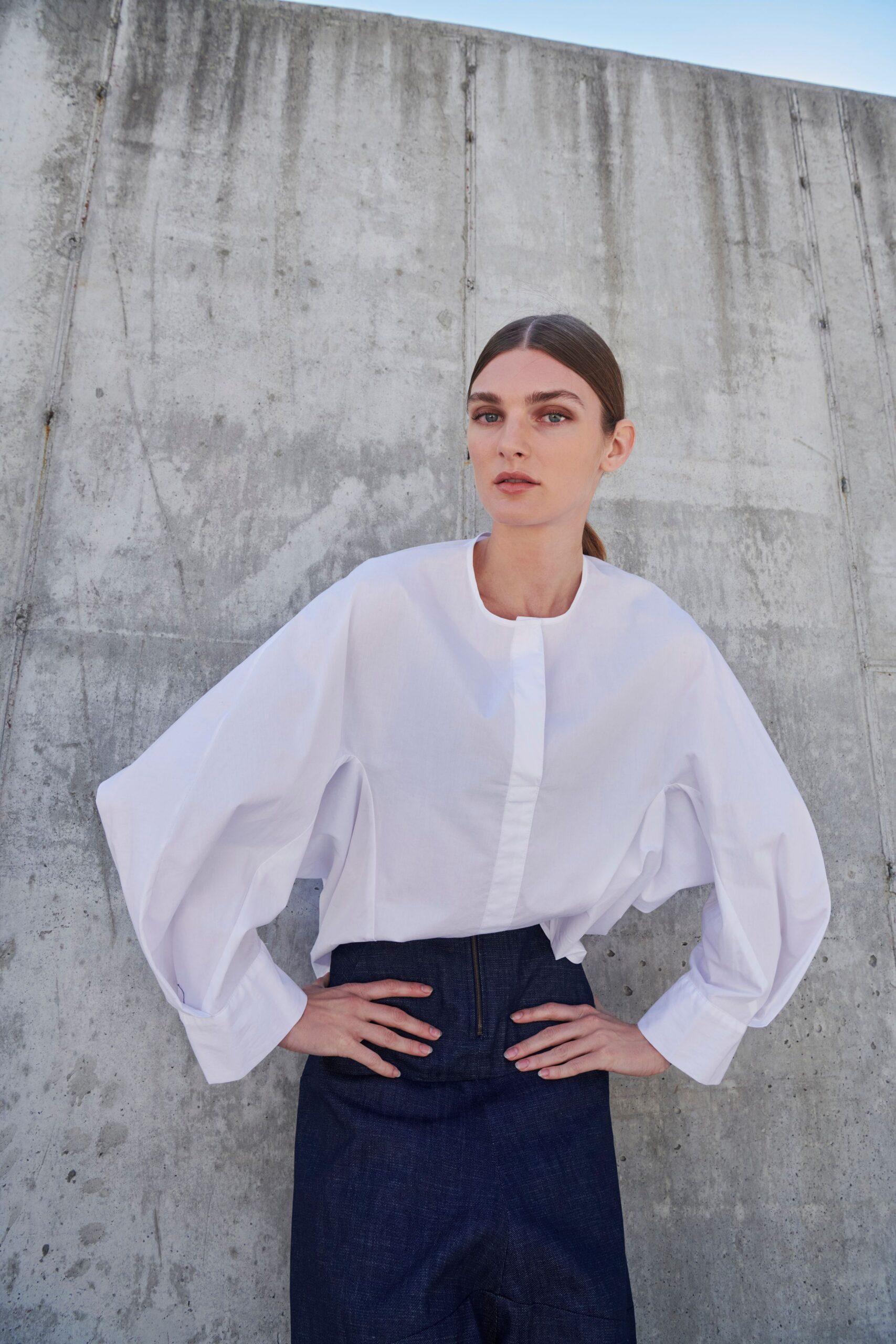white relaxed shirt with blue pants