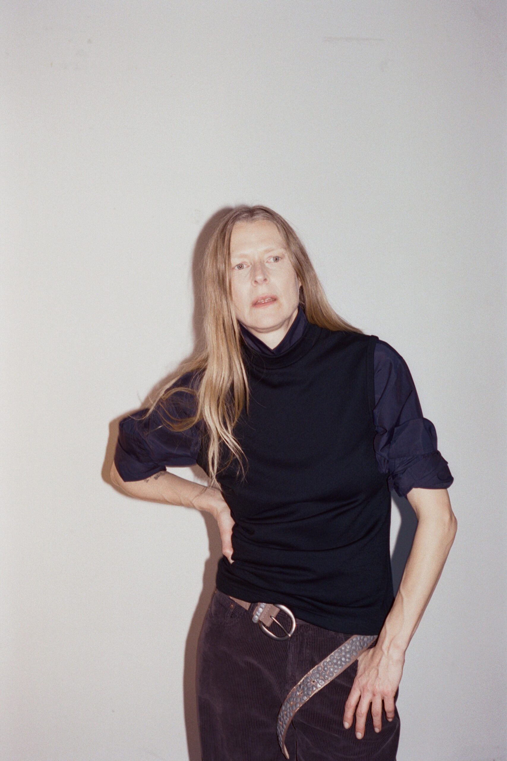 black fitted top with blue shirt