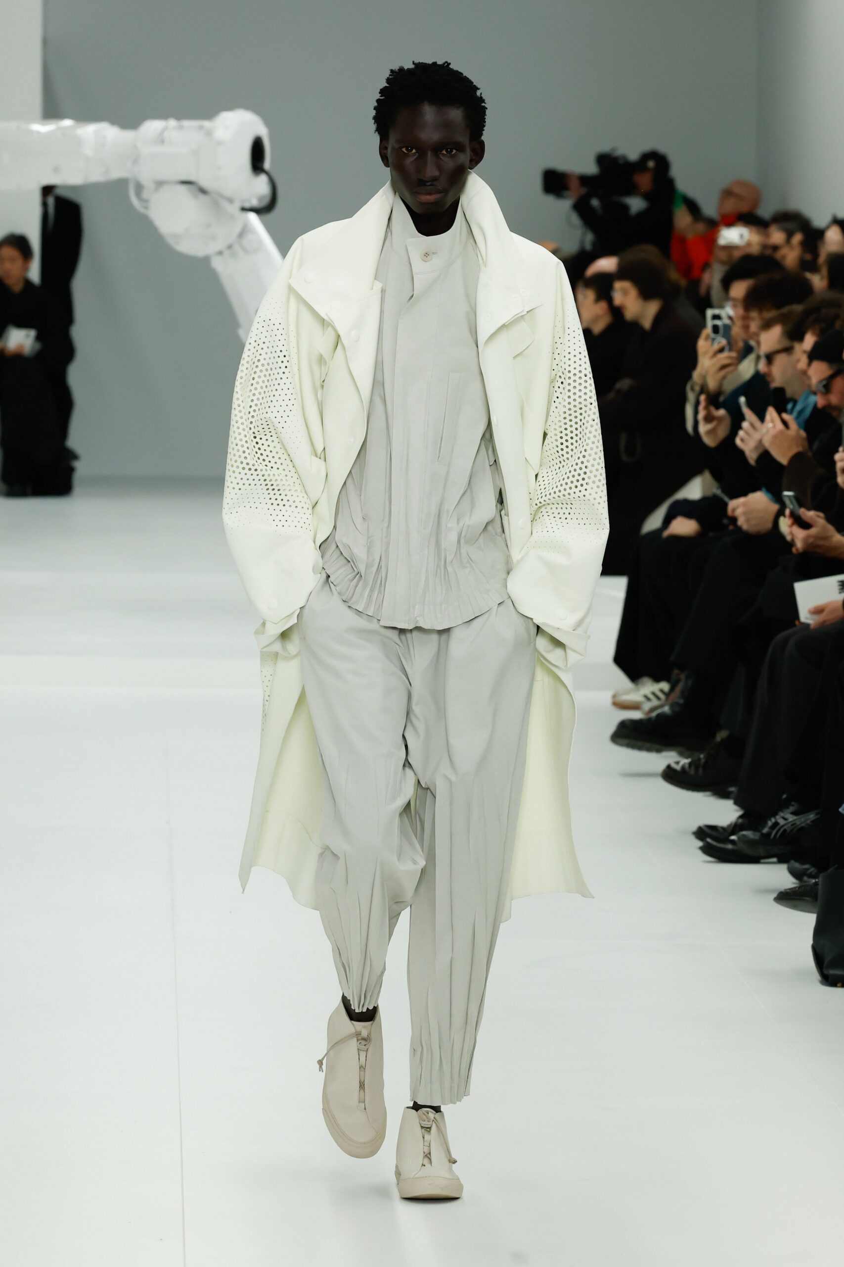 white relaxed coat with gray pants
