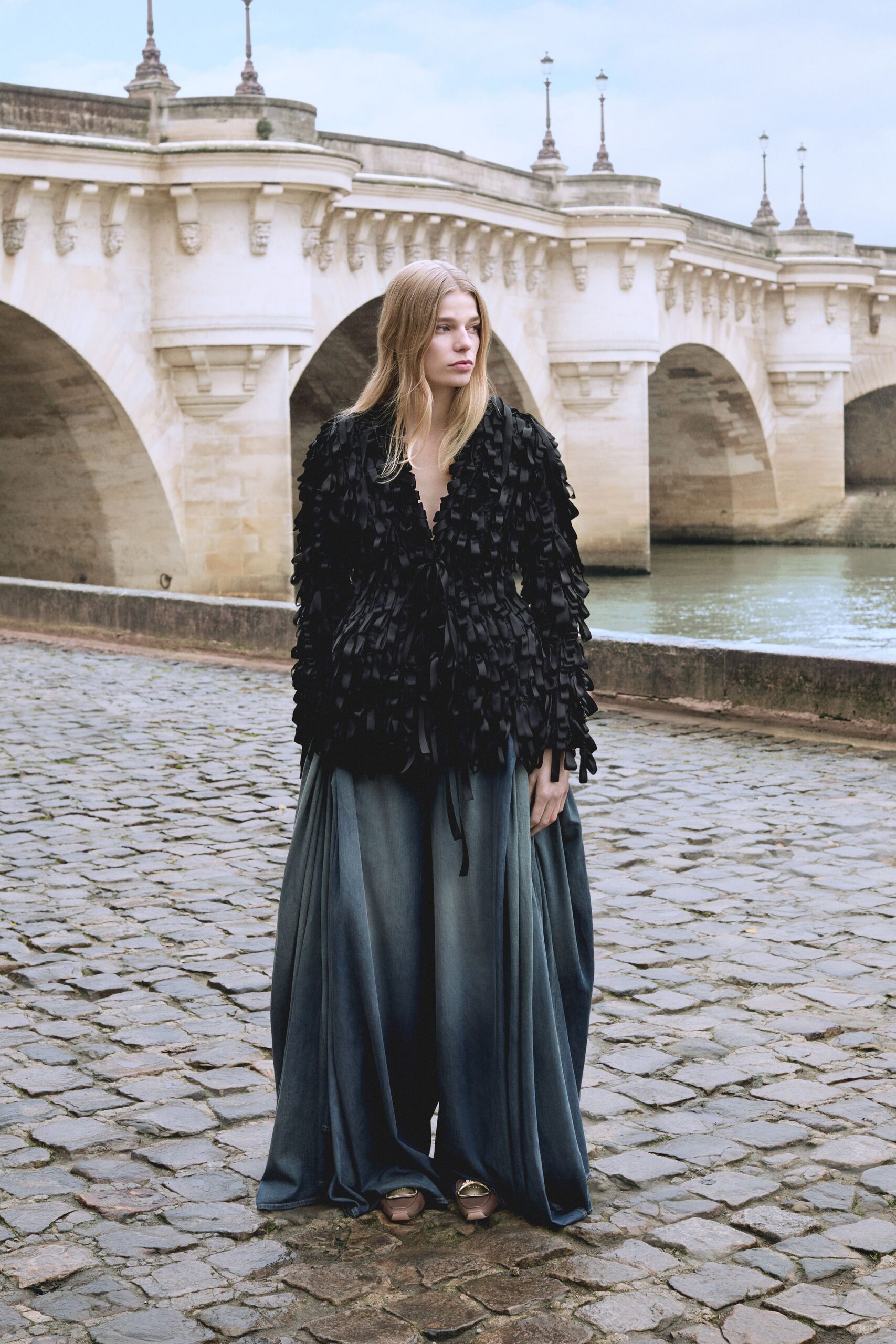 black ruffled top with blue layered skirt