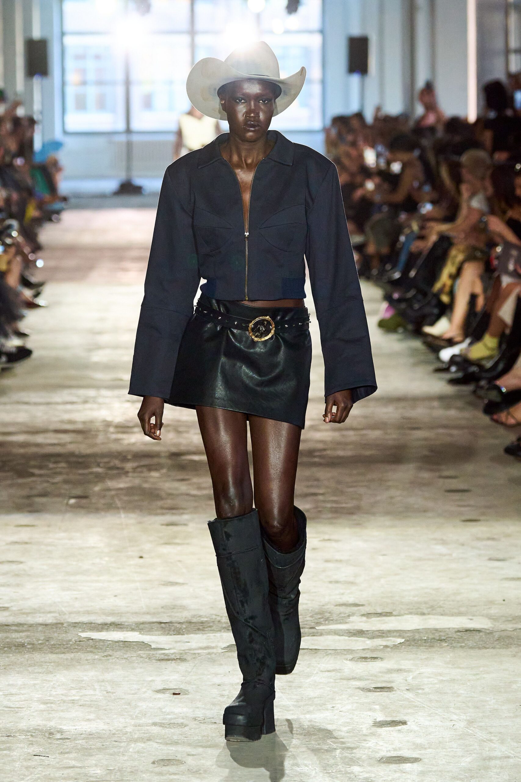 black fitted jacket and mini skirt