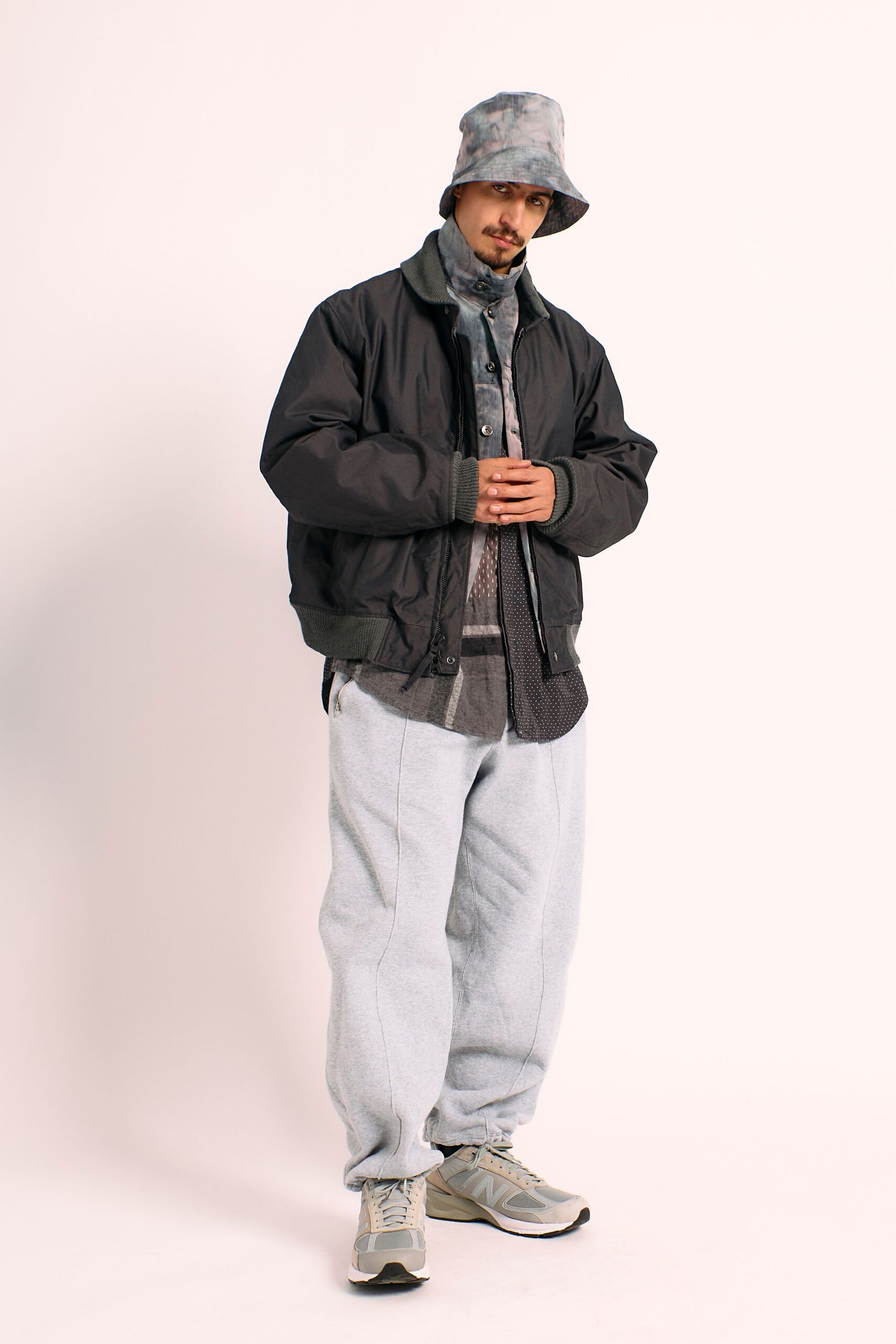 relaxed black jacket with gray shirt and pants