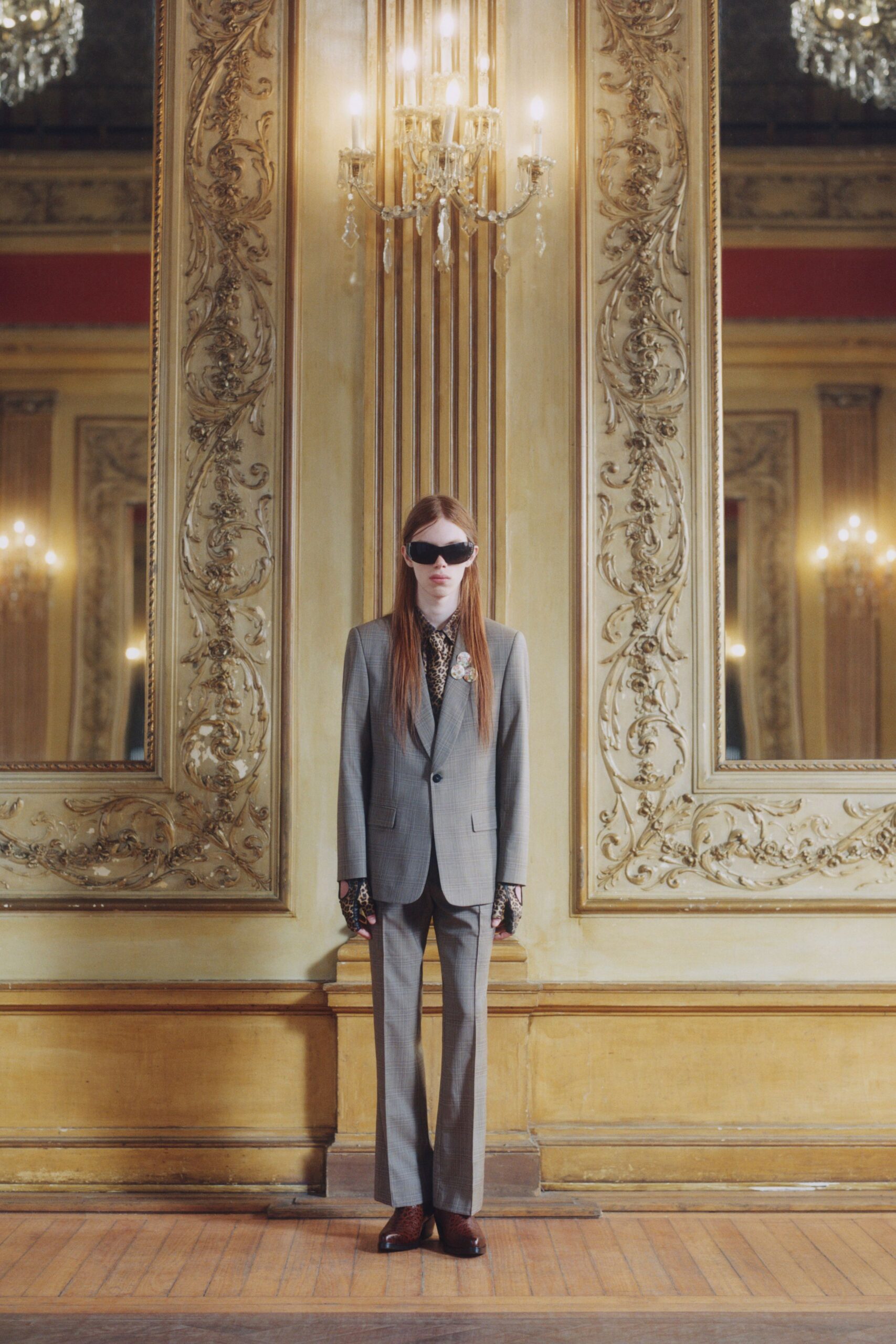 gray tailored suit with sunglasses