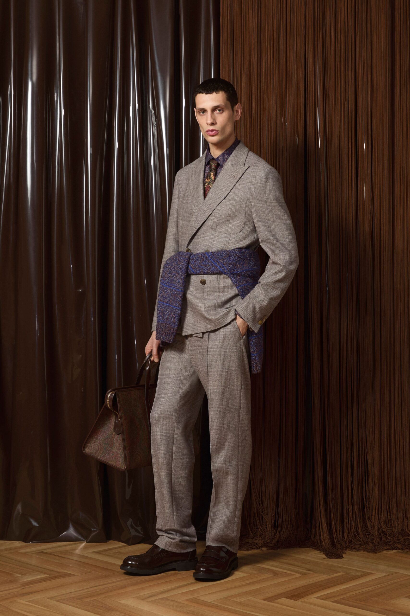 gray tailored suit with blue belt