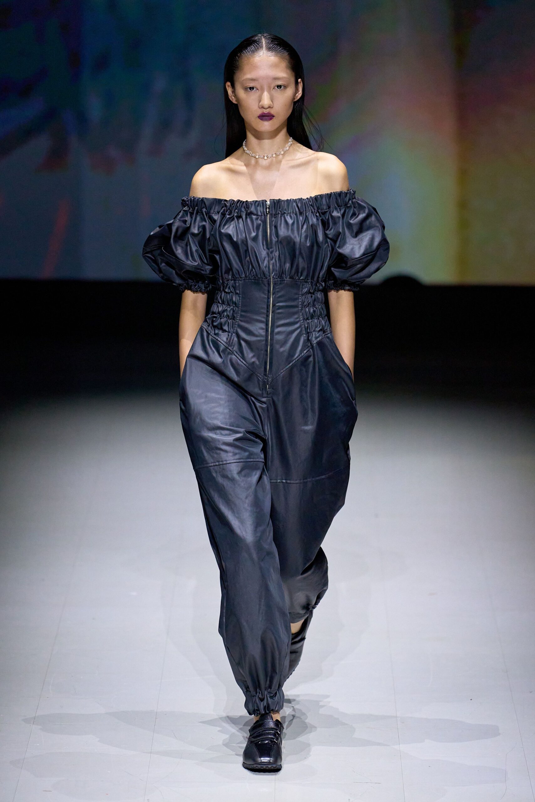 black leather sleeveless off-shoulder fitted zippered pockets jumpsuit