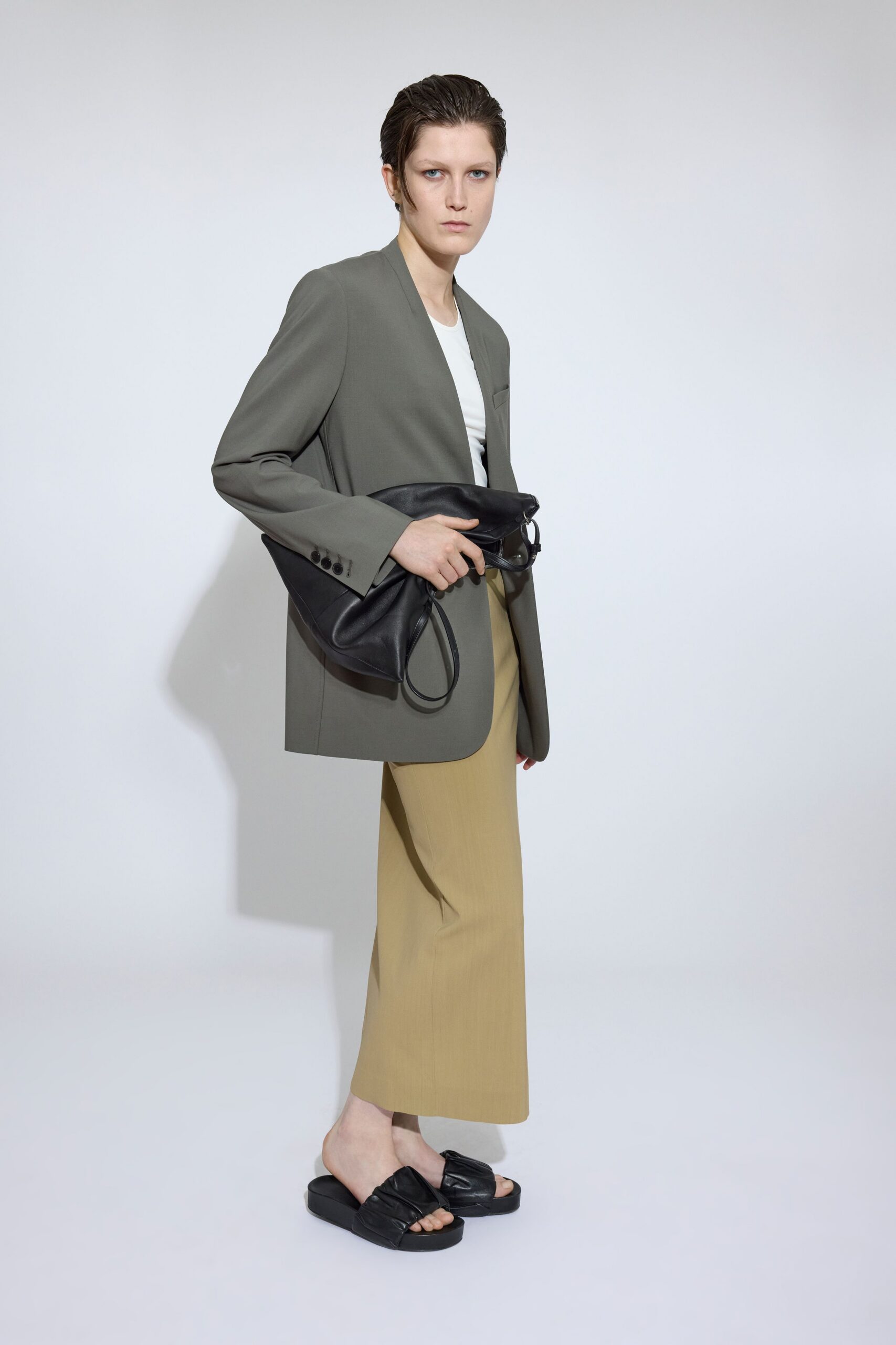 gray blazer with beige skirt