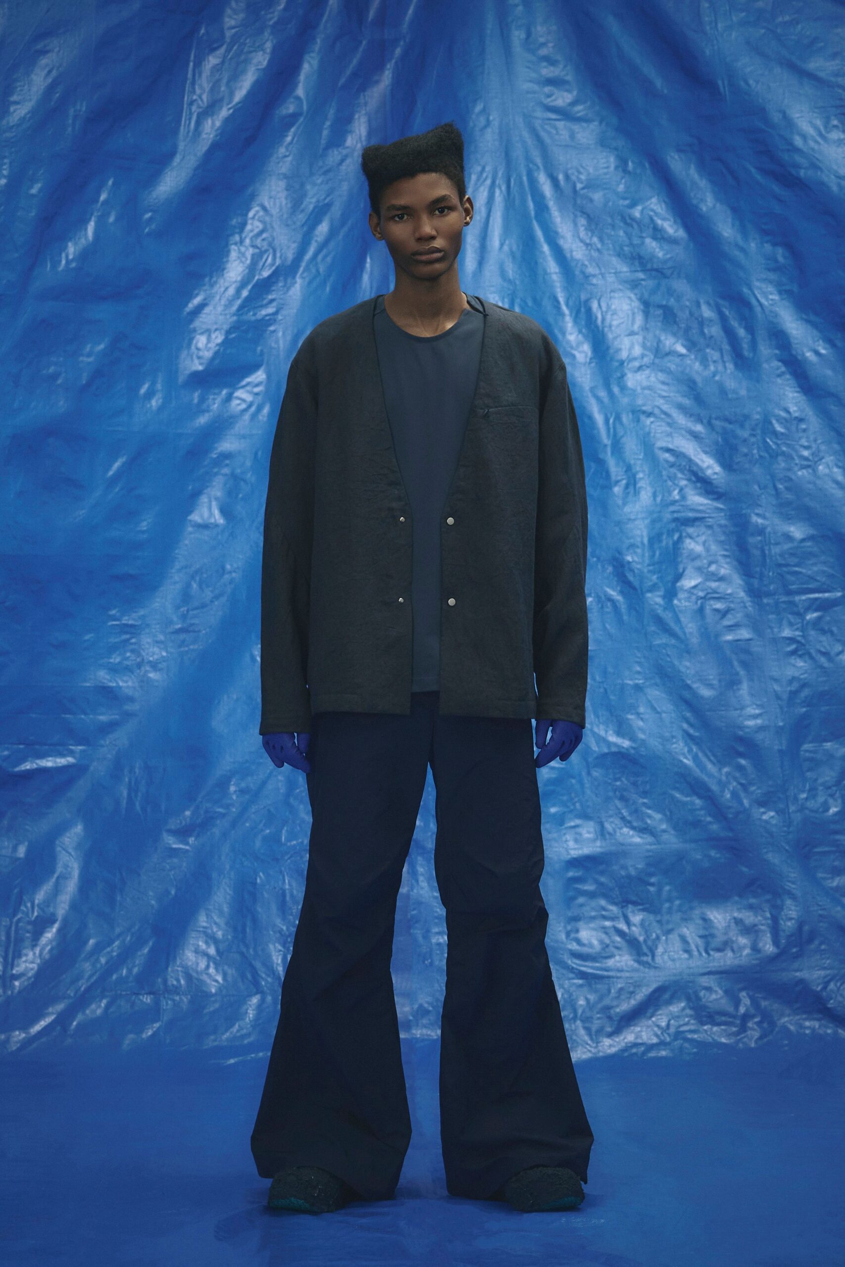black relaxed jacket with blue flared pants