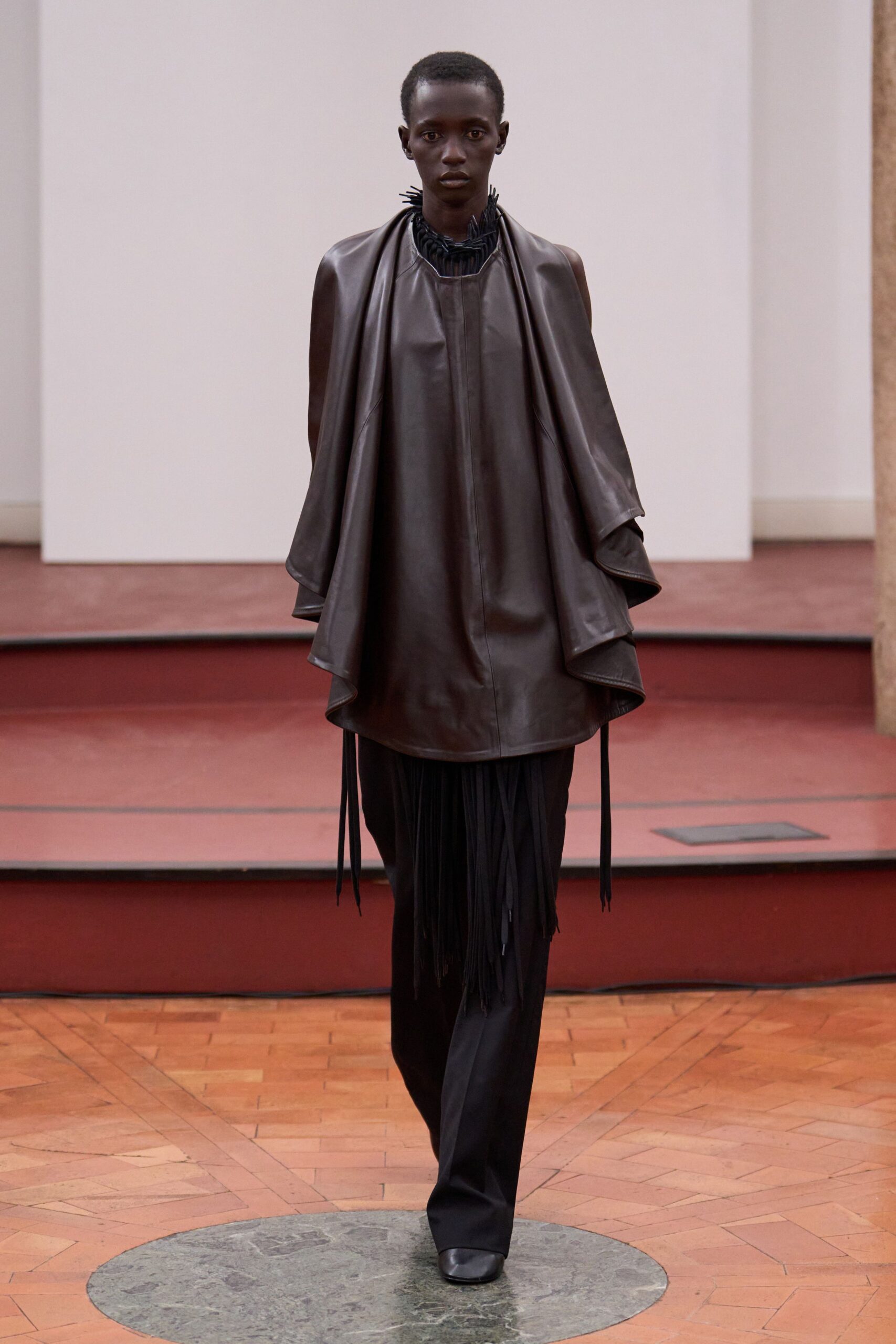 black leather cape and pants
