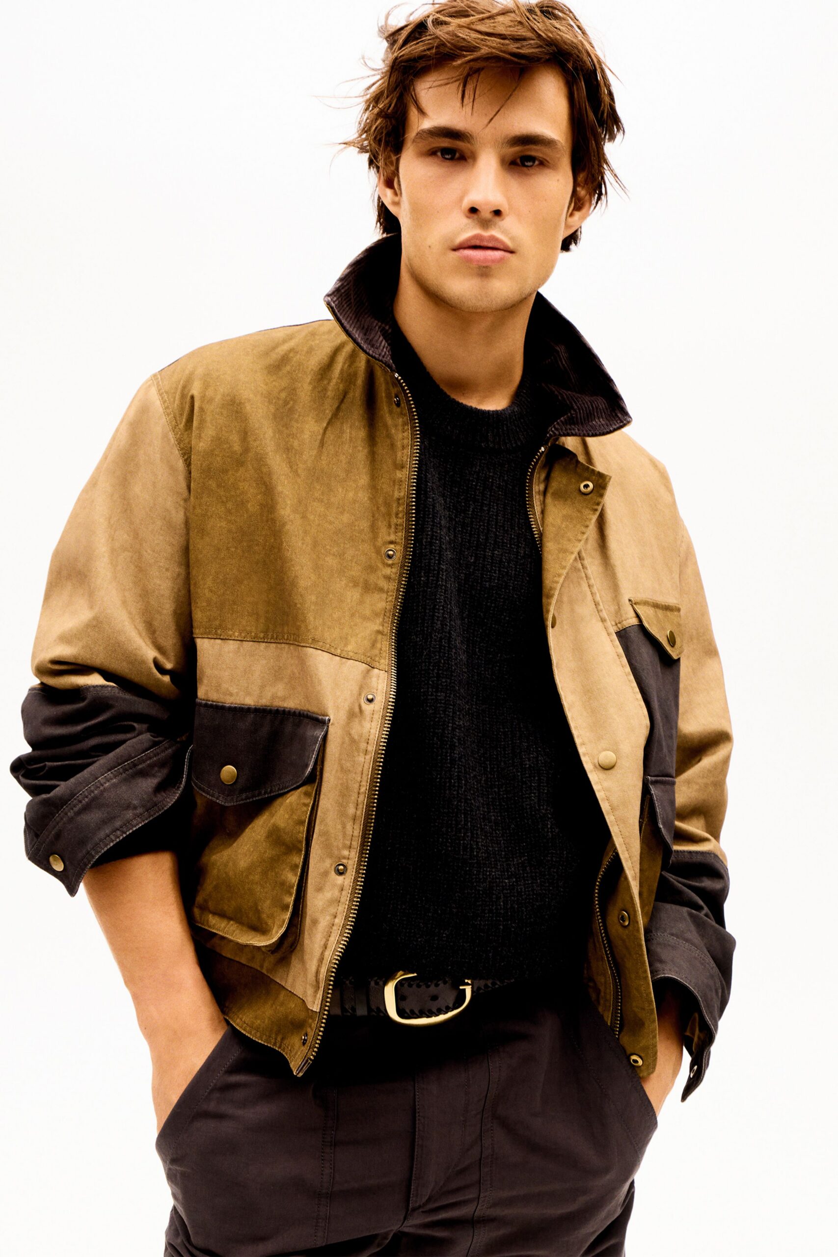 brown and black relaxed jacket with black sweater