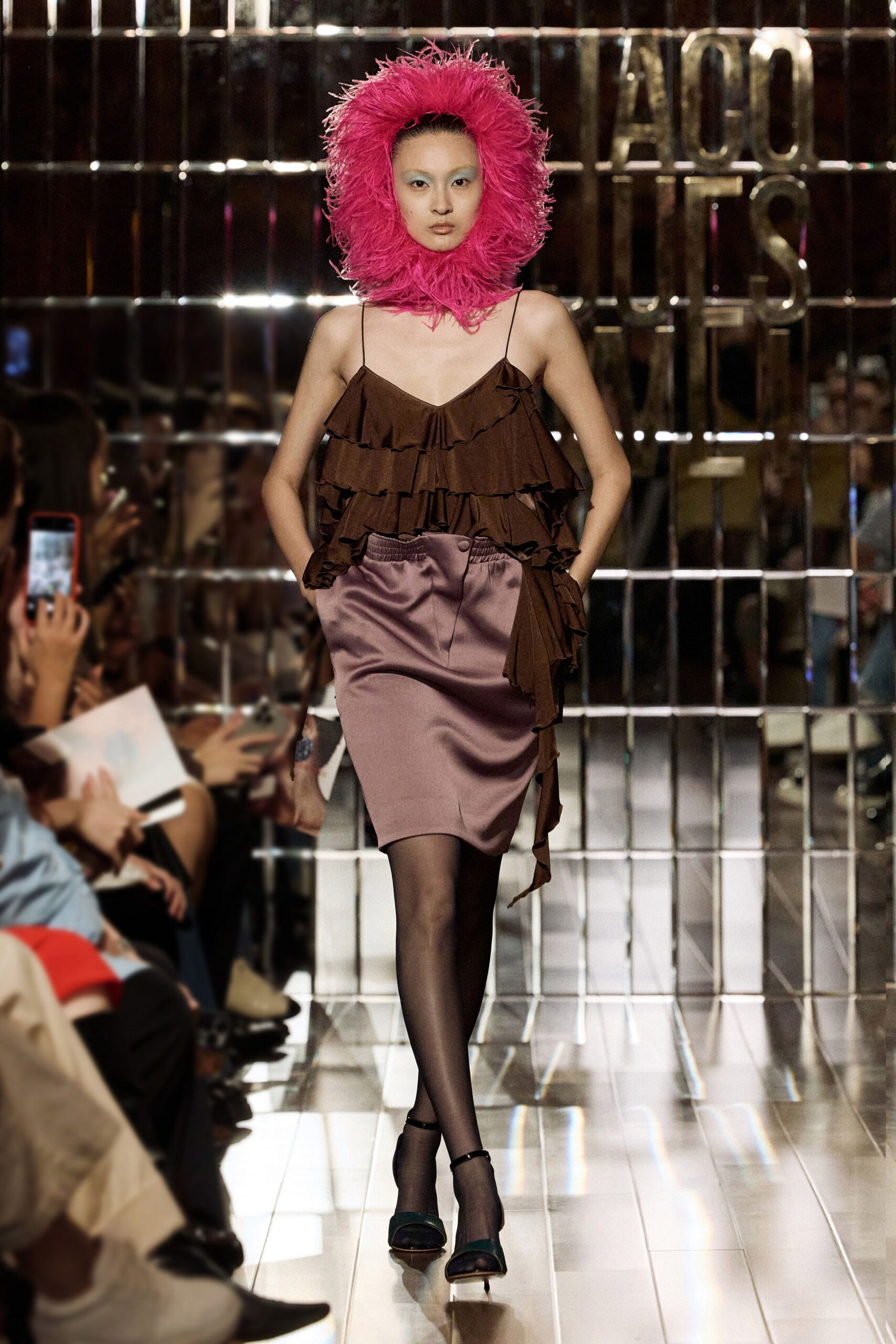 brown ruffled dress with pink hat