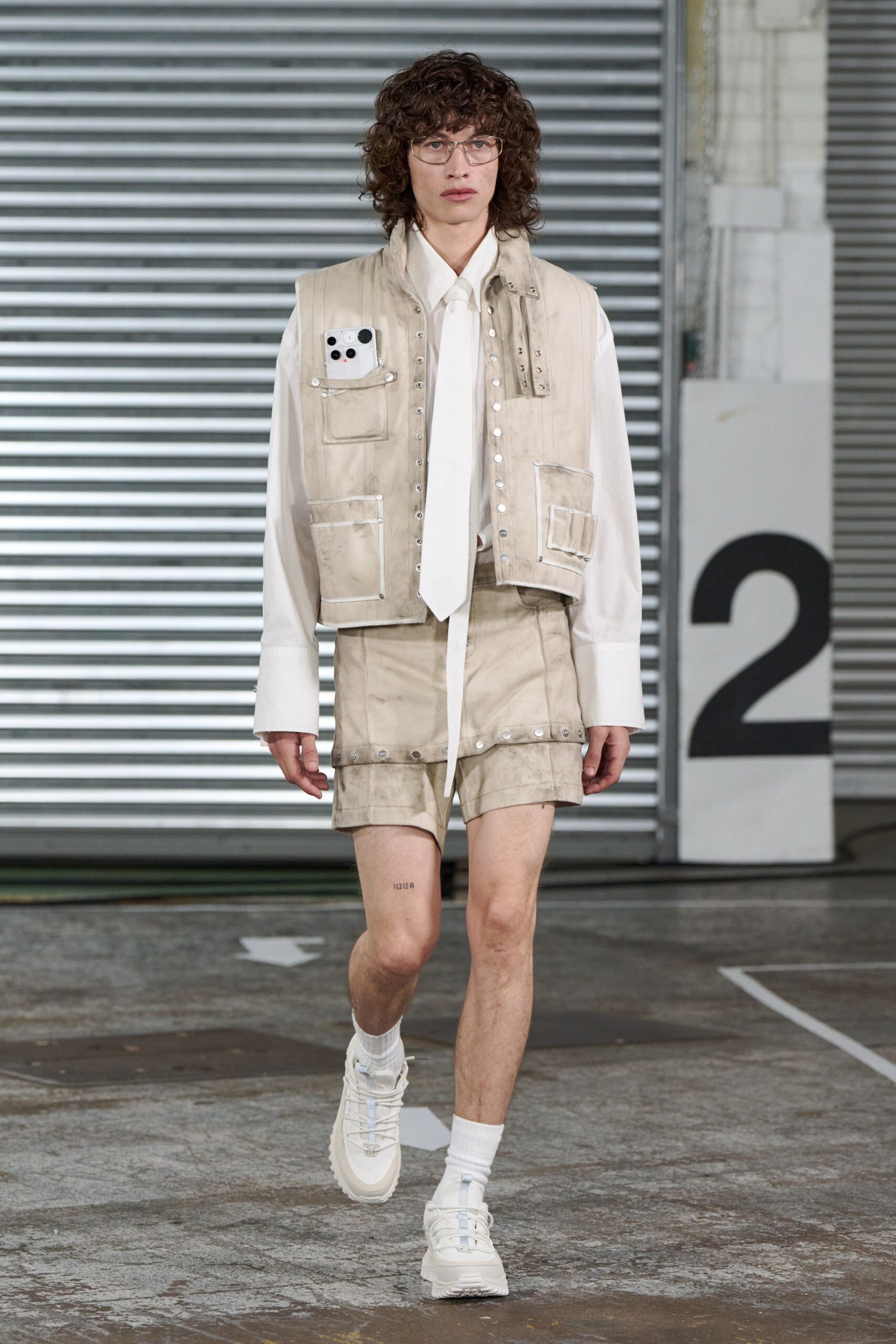 beige cotton vest with white shirt