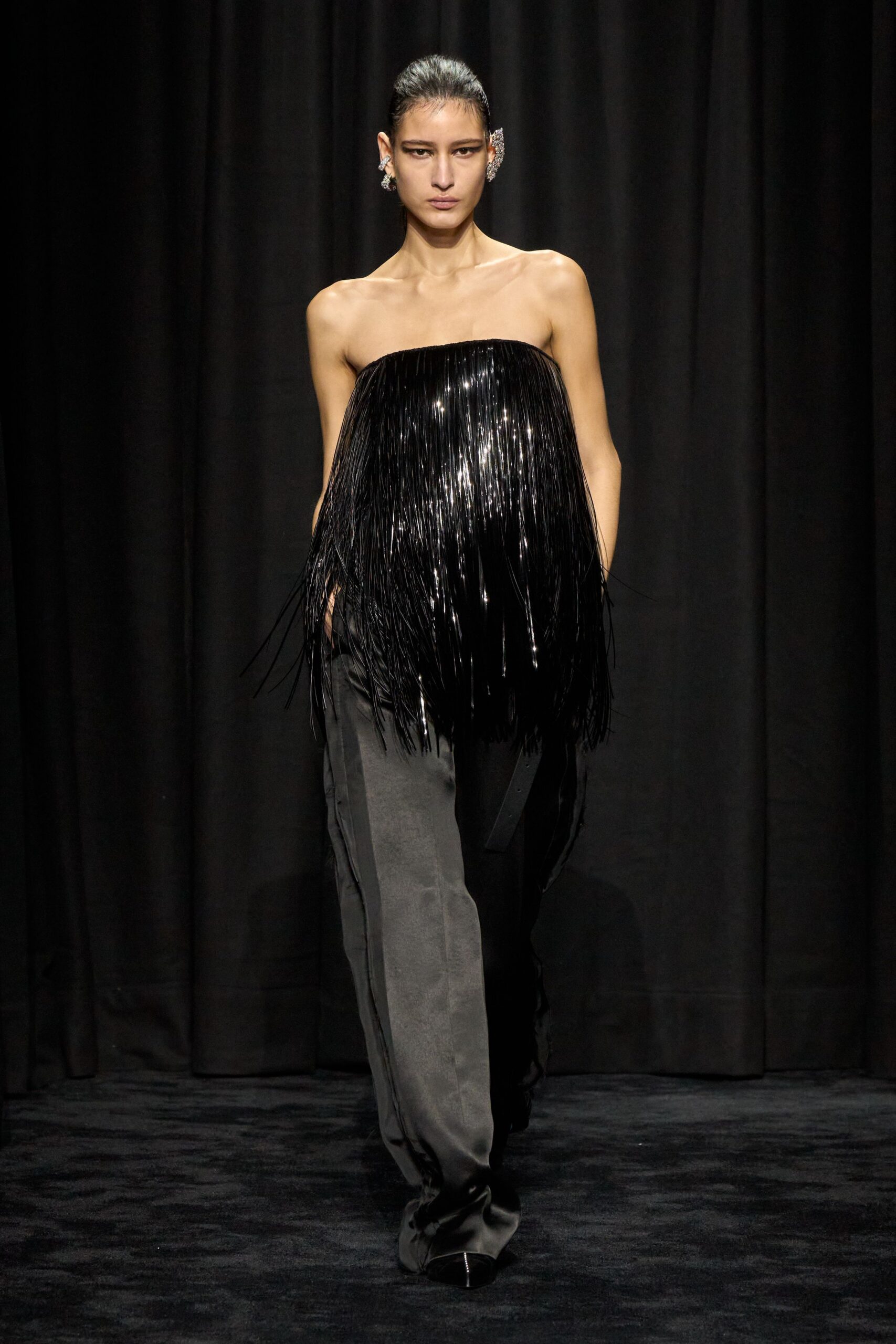 black fringed top with relaxed pants