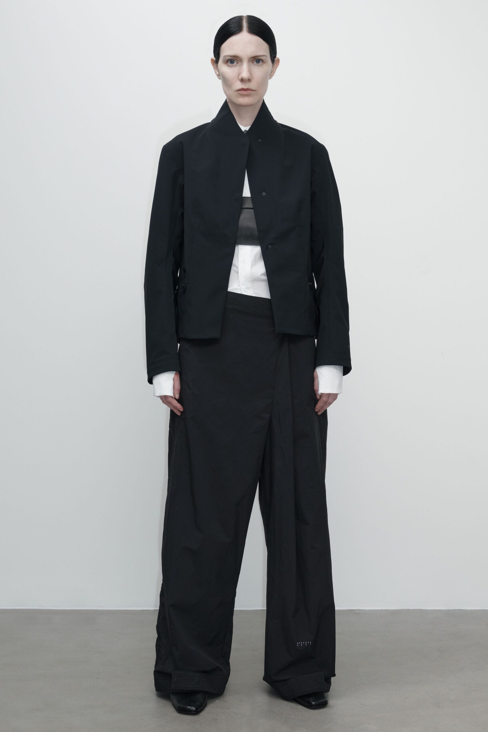 black jacket white shirt relaxed pants