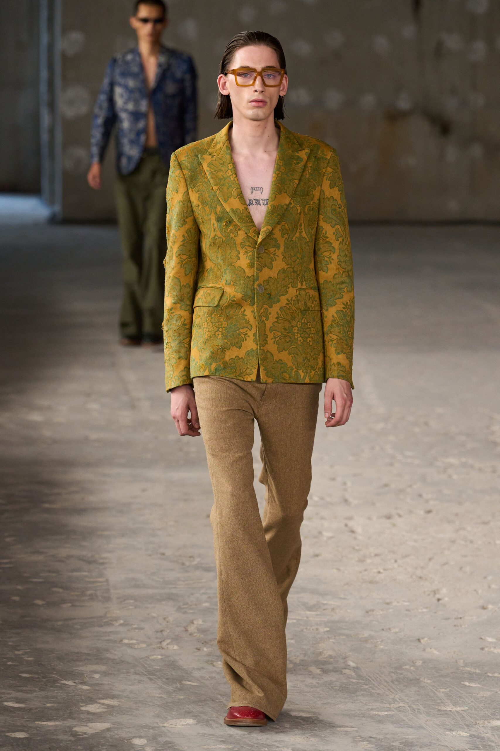 green embroidered blazer with brown pants