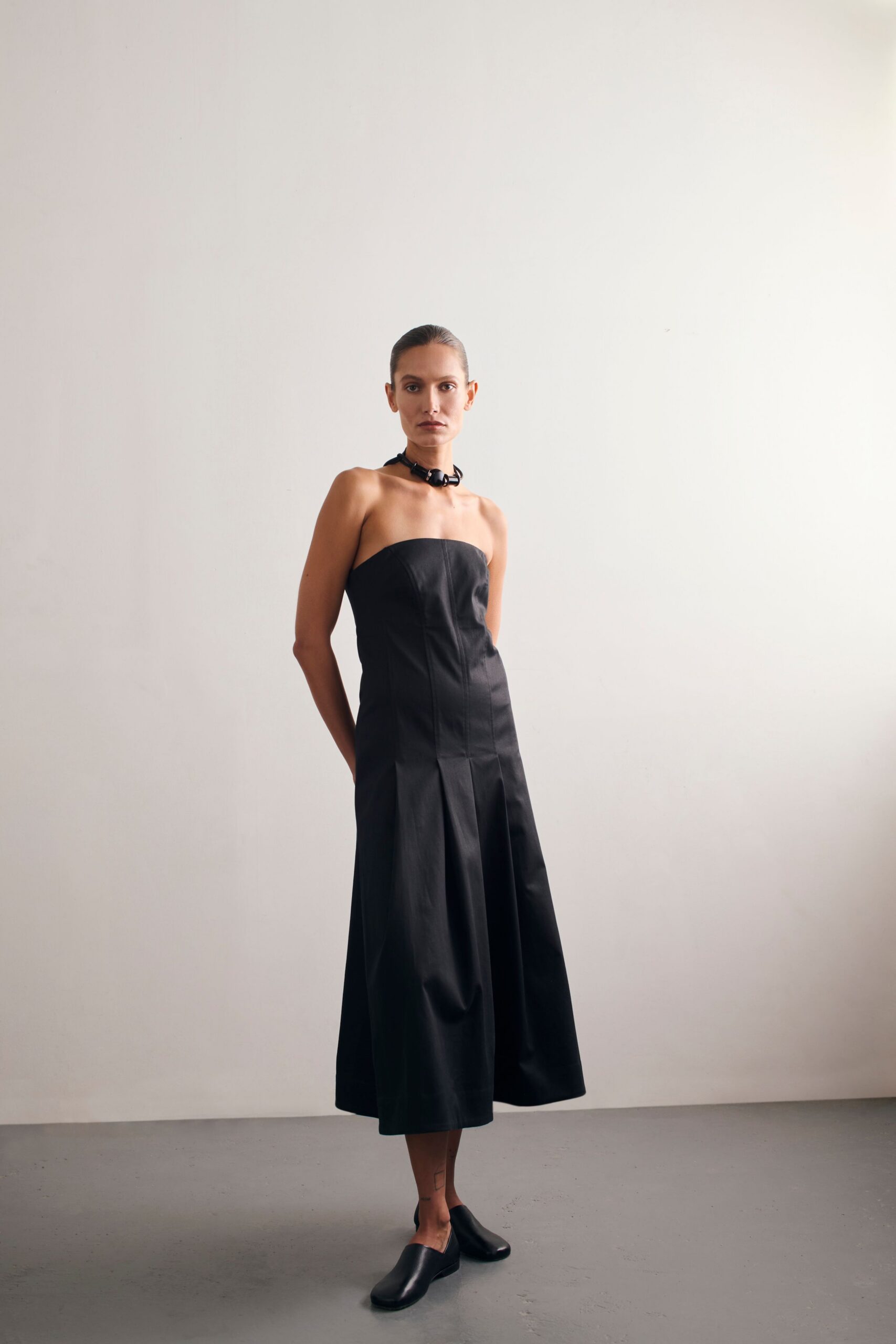 black cotton strapless fitted flared midi dress