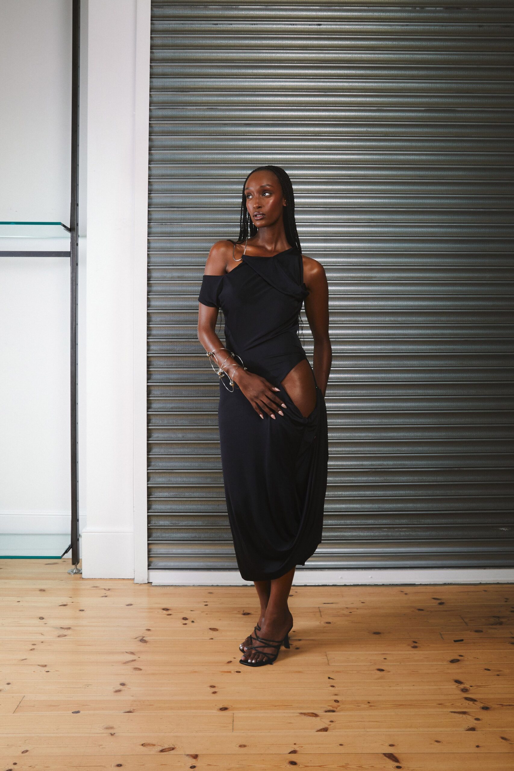black cotton sleeveless off-shoulder fitted ruched midi dress