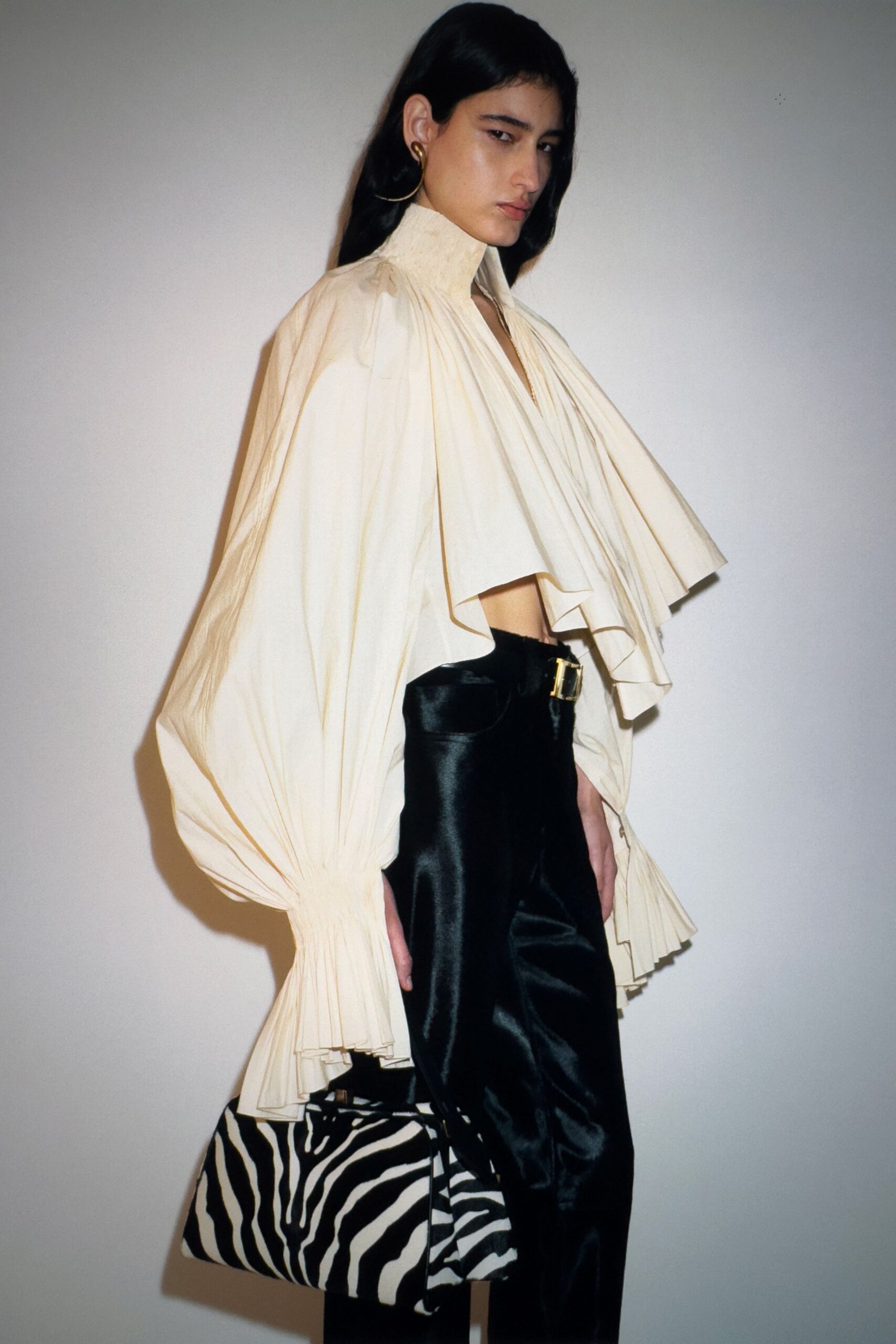 white pleated blouse black pants