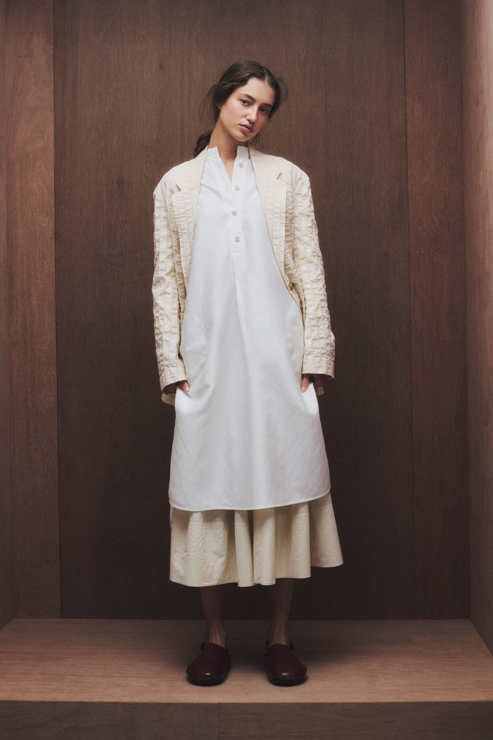 white cotton midi dress with beige coat