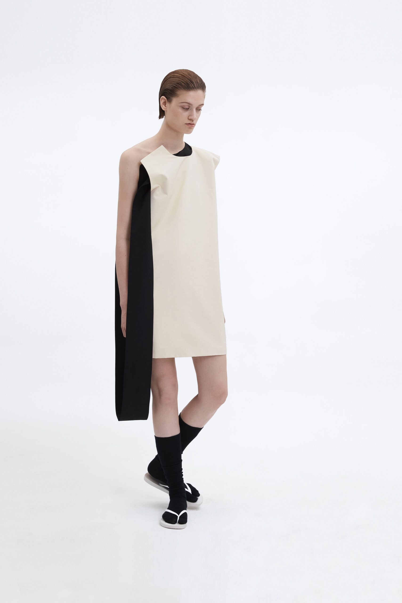 asymmetric beige and black dress