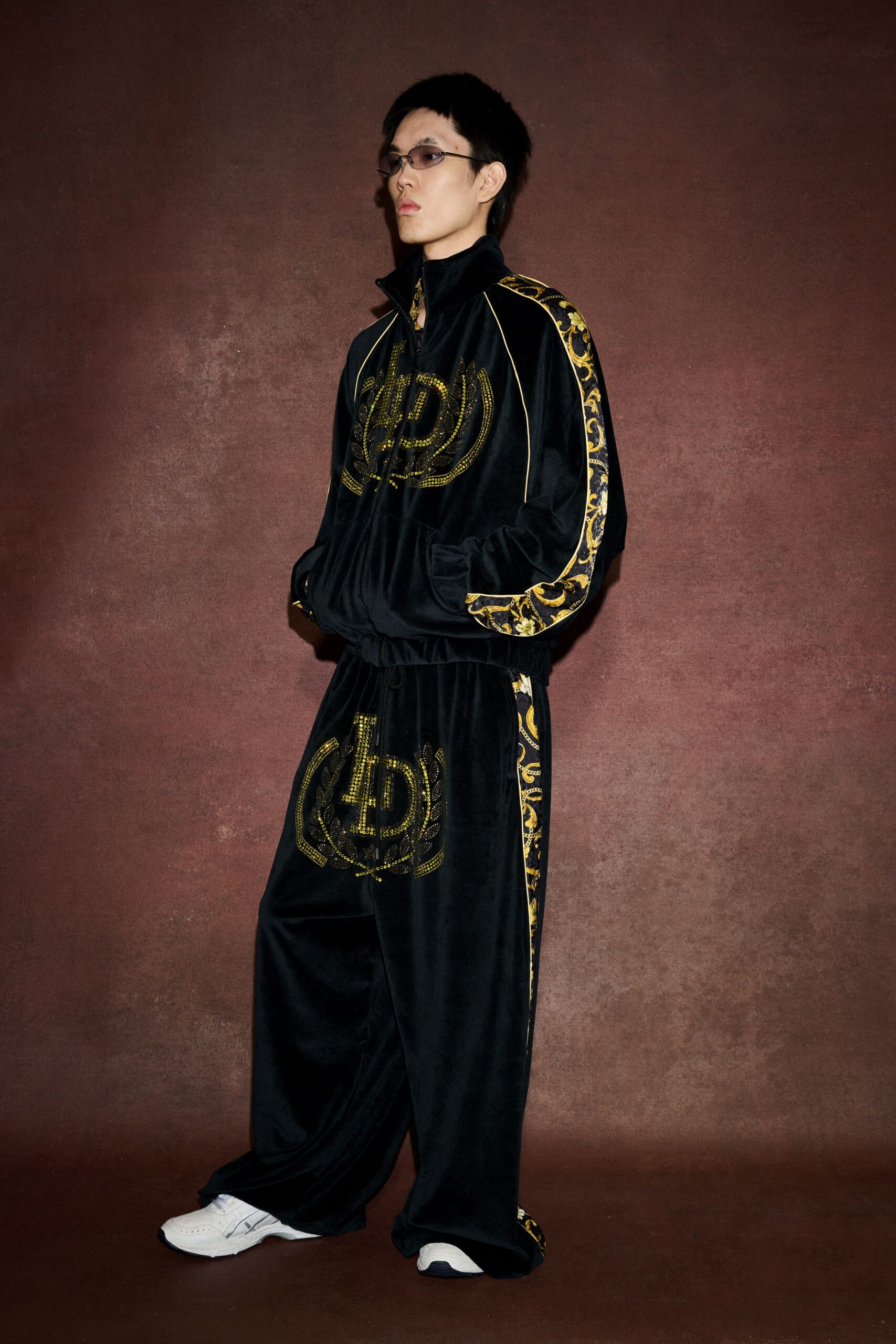 black velvet tracksuit with sunglasses