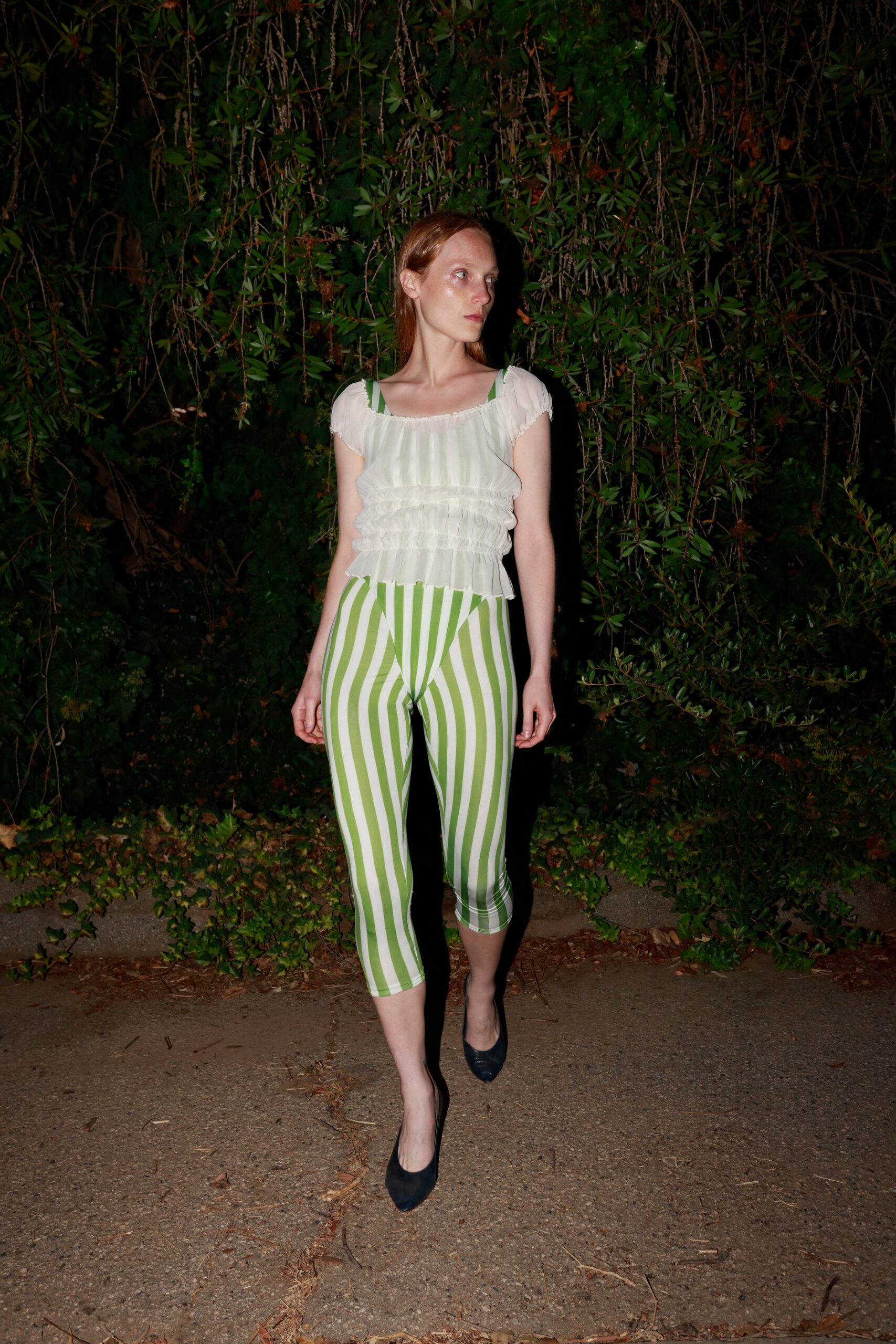 white ruffled top green striped pants