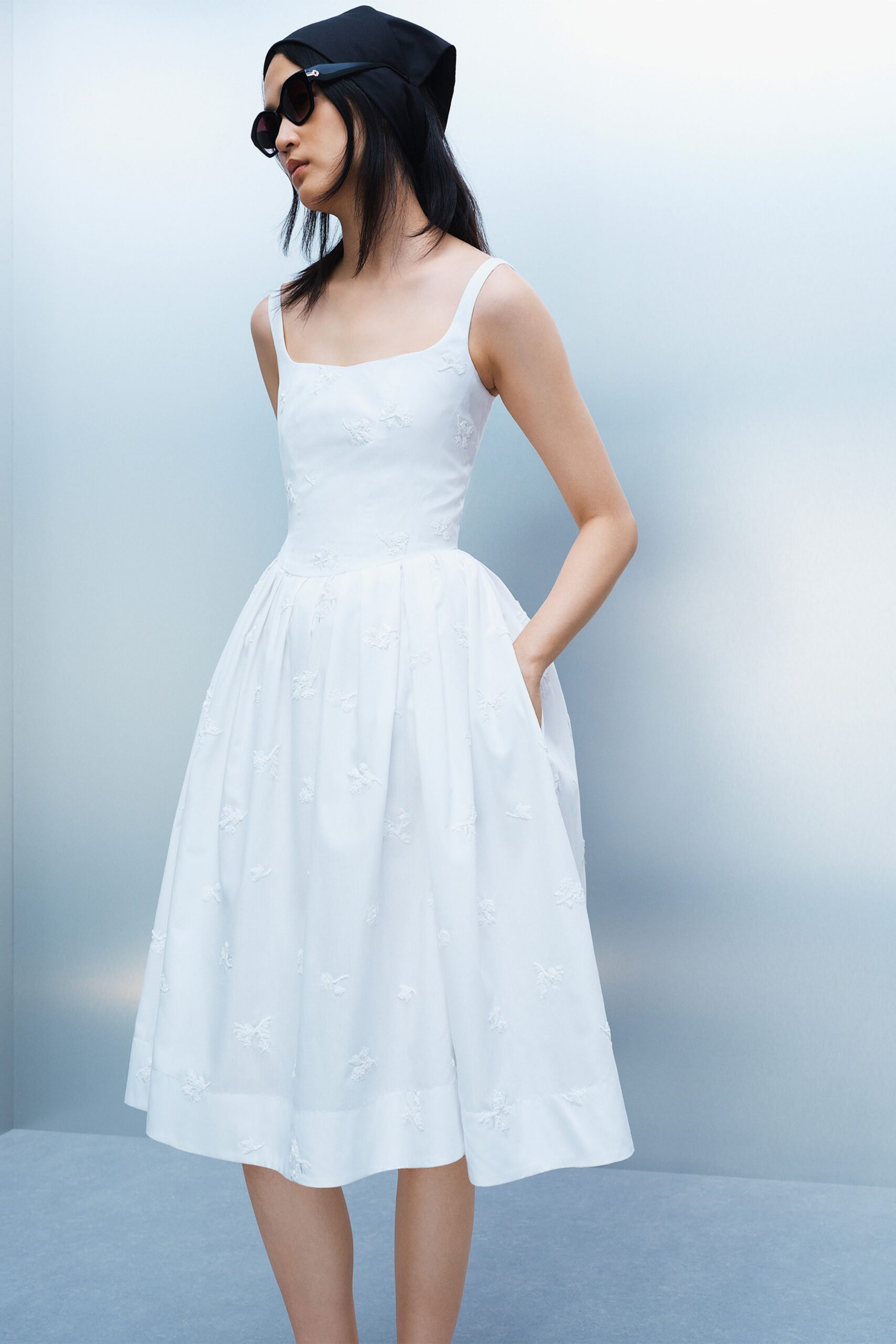 white midi dress with black accessories