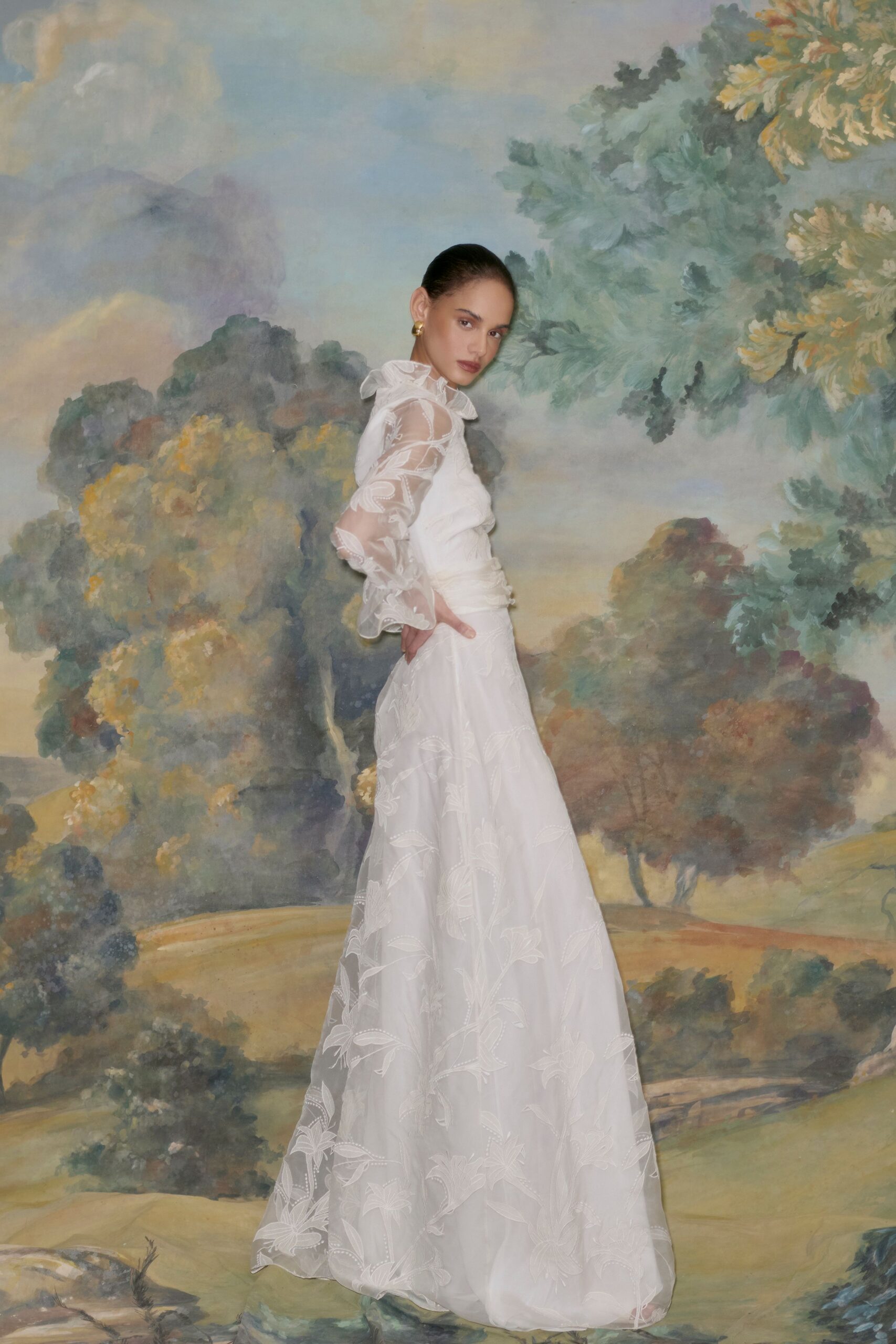 white embroidered long-sleeve gown