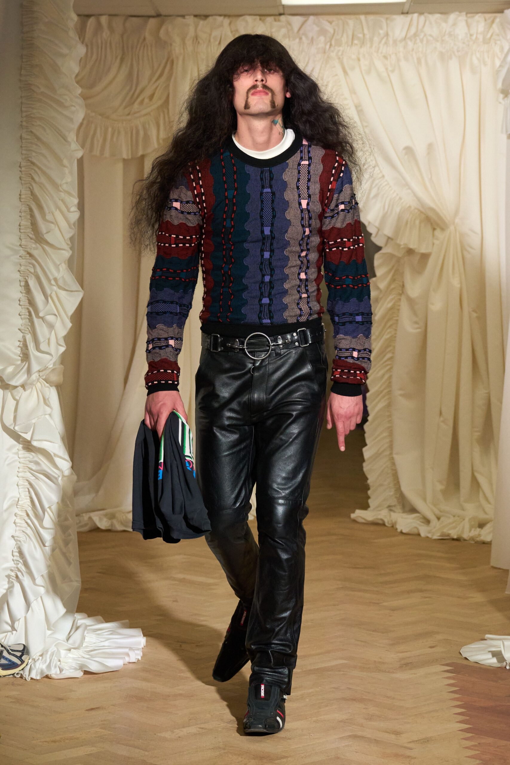 multi-colored fitted sweater with black leather pants