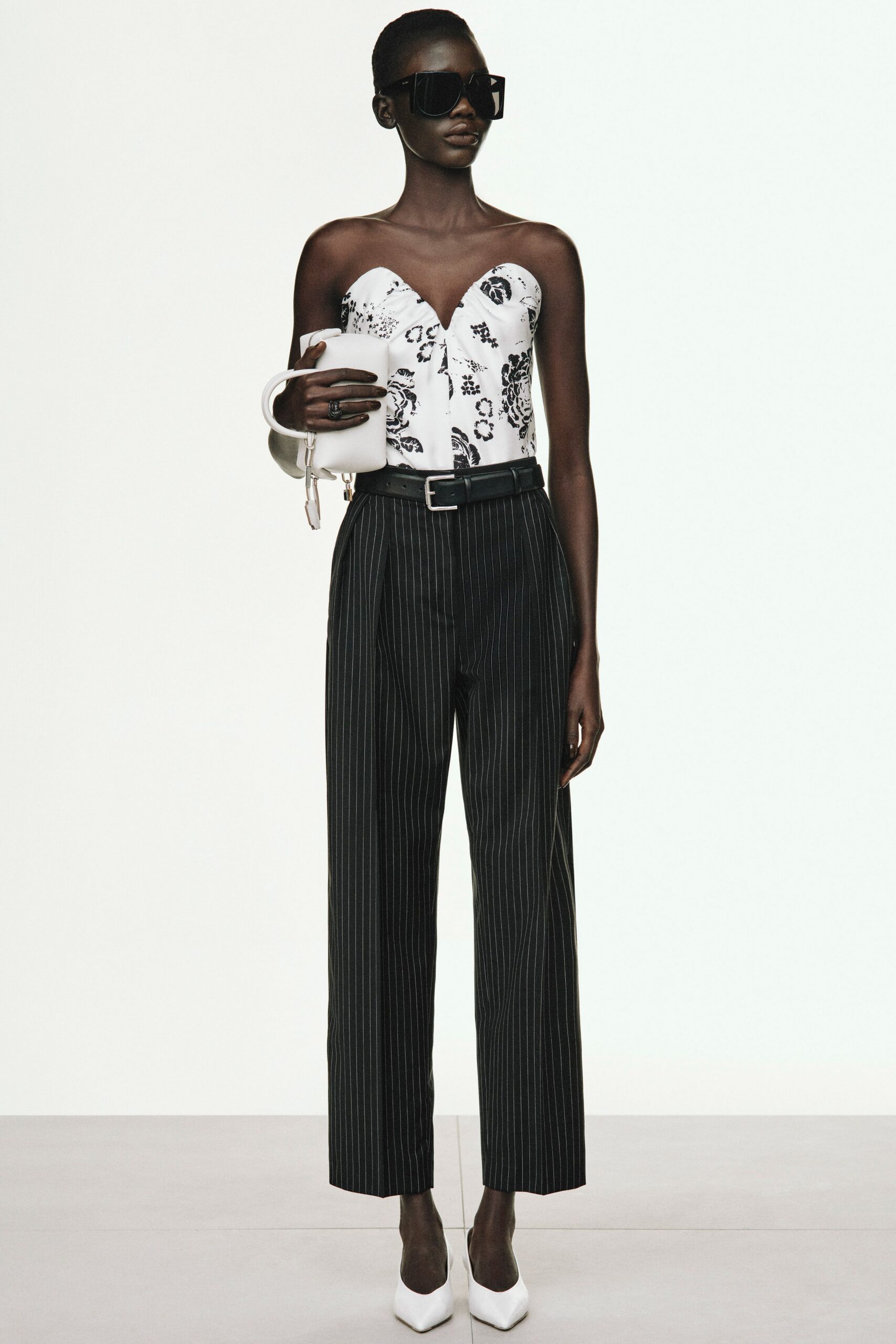 black and white printed bodysuit with relaxed pants