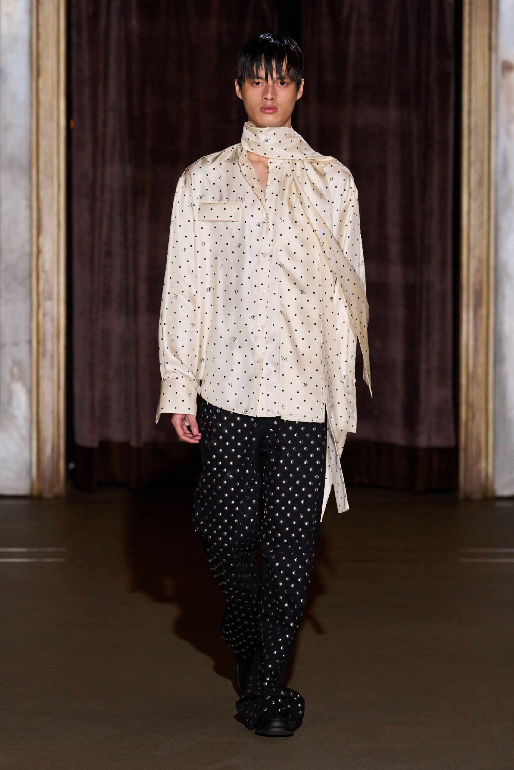 white polka-dot shirt with black pants