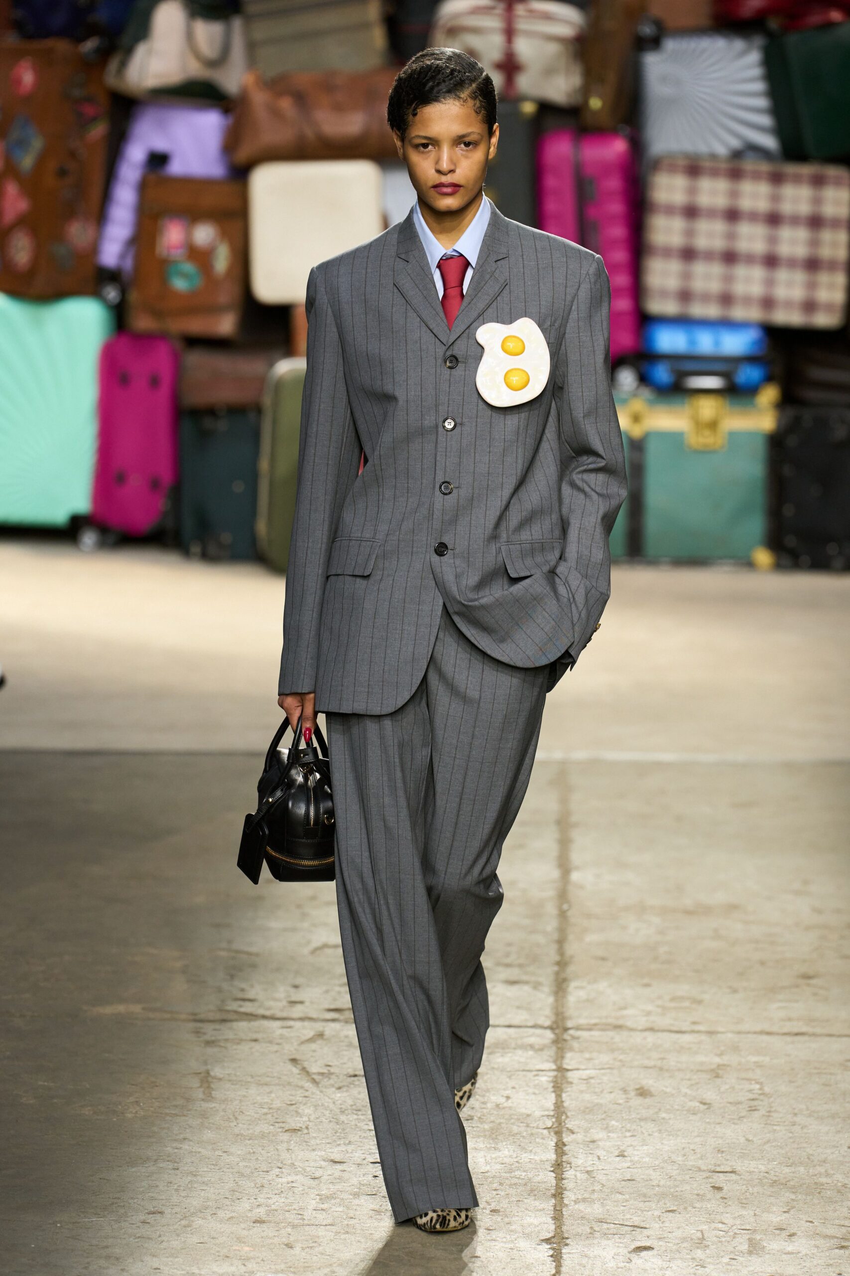 gray tailored suit with red tie