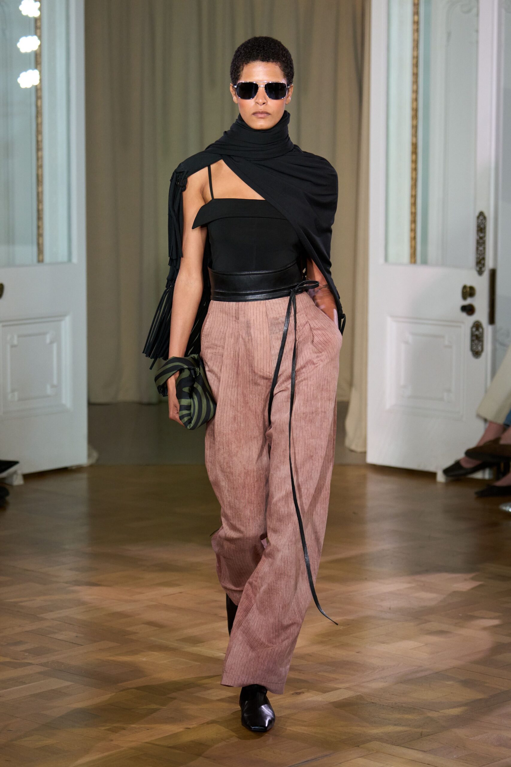 black fitted off-shoulder top with pink relaxed pants