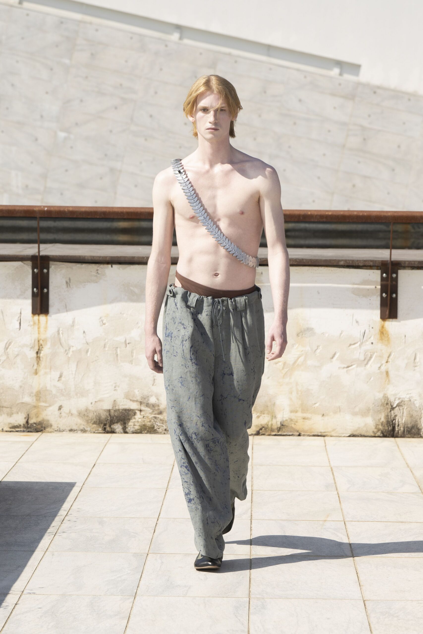 gray relaxed pants with silver belt