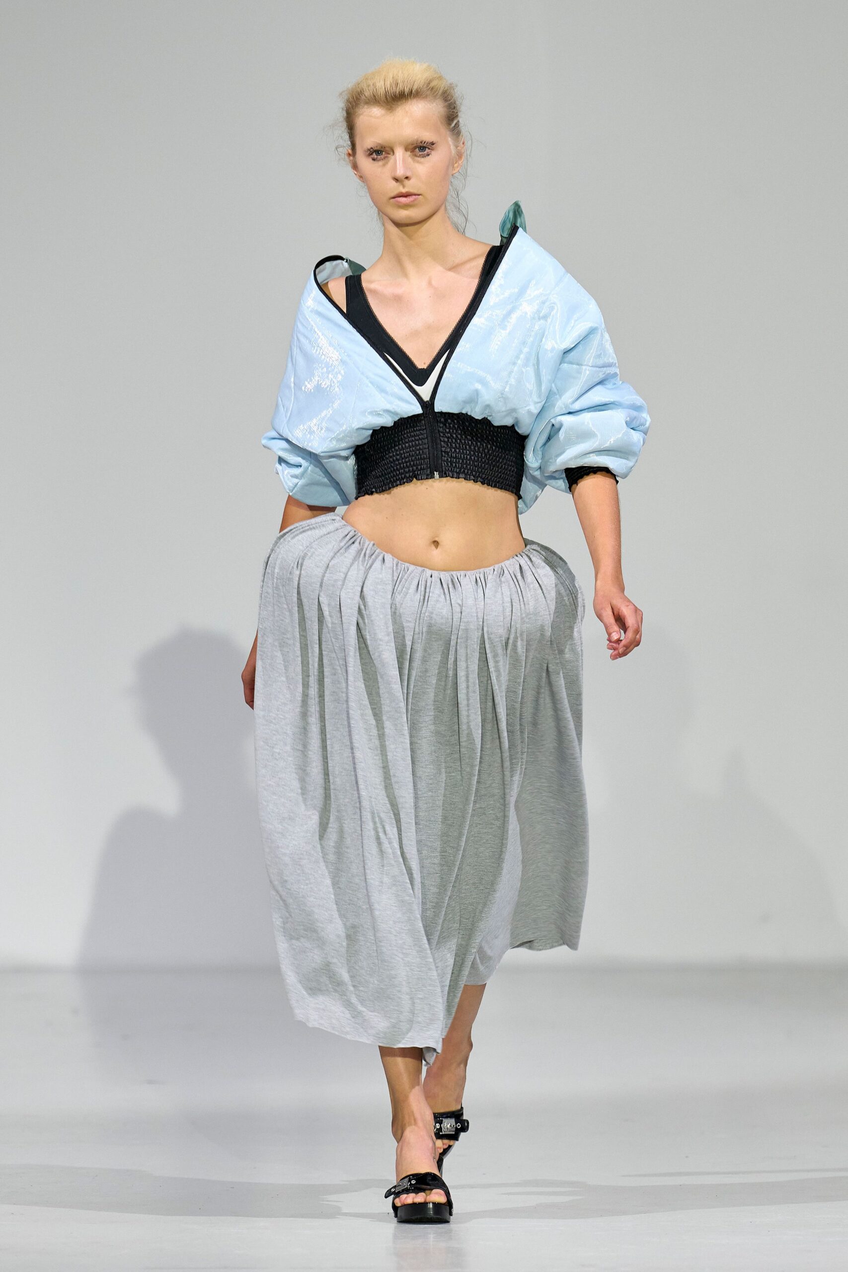 blue relaxed top gray pleated skirt