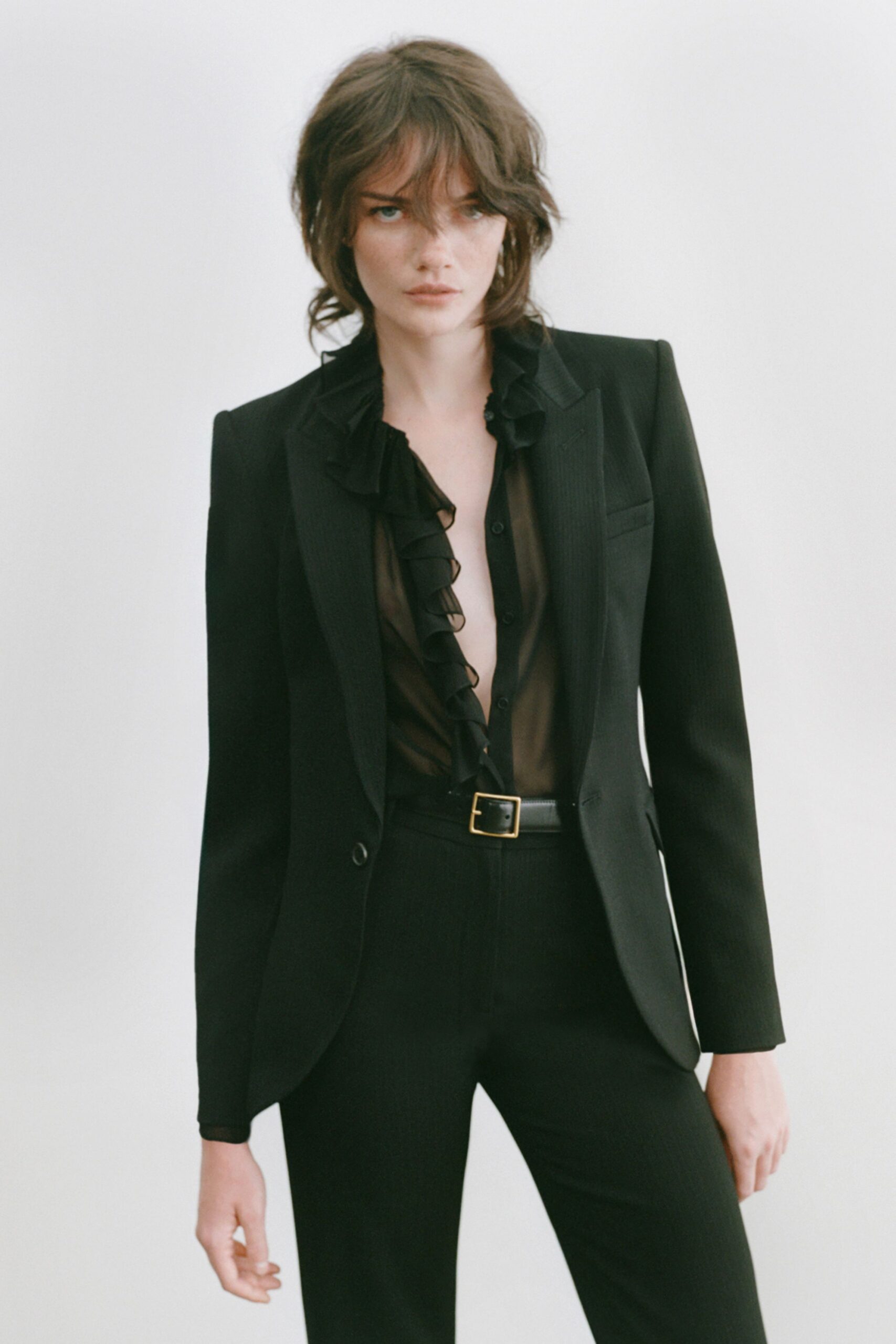 black long-sleeve v-neck fitted ruffled sheer shirt
