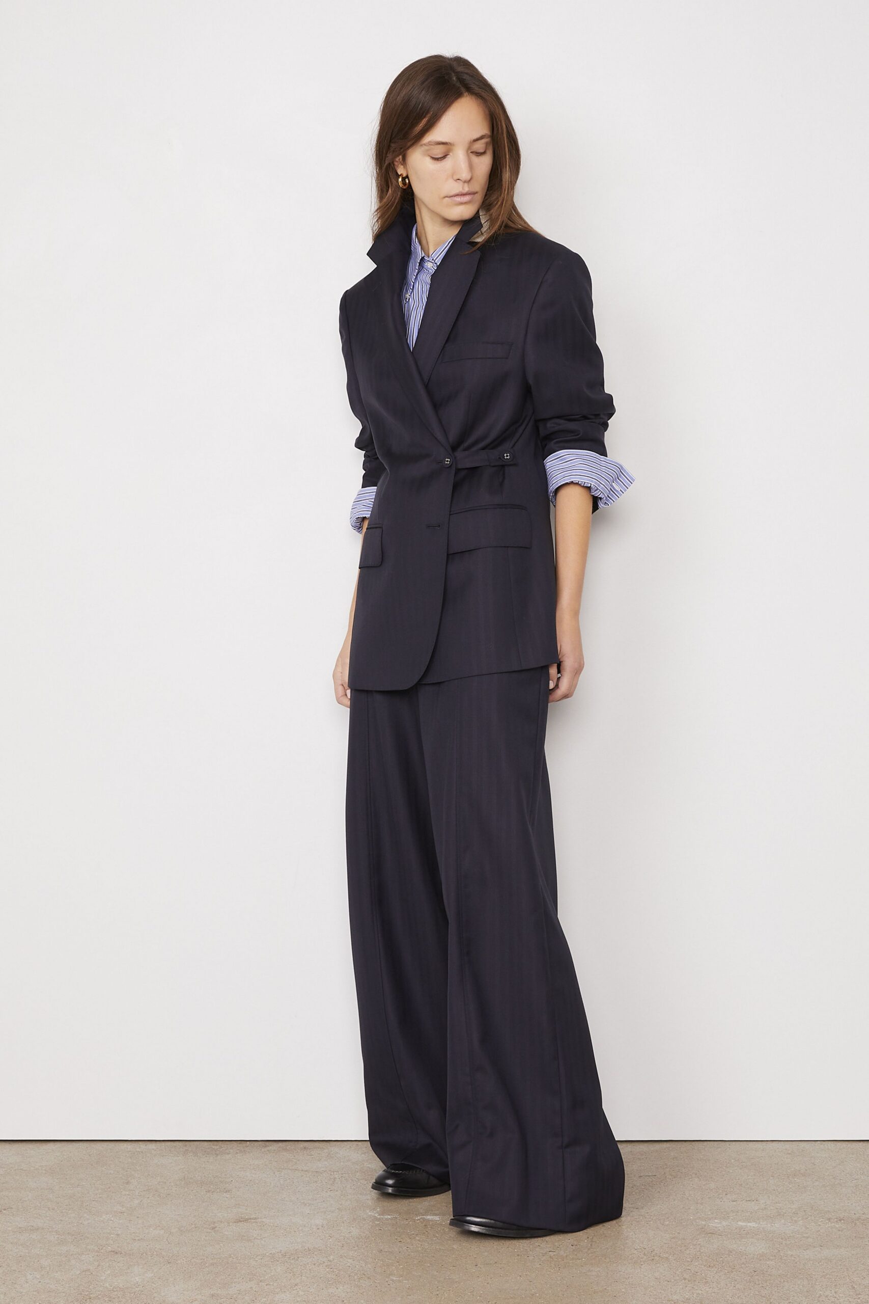 black tailored blazer with striped shirt