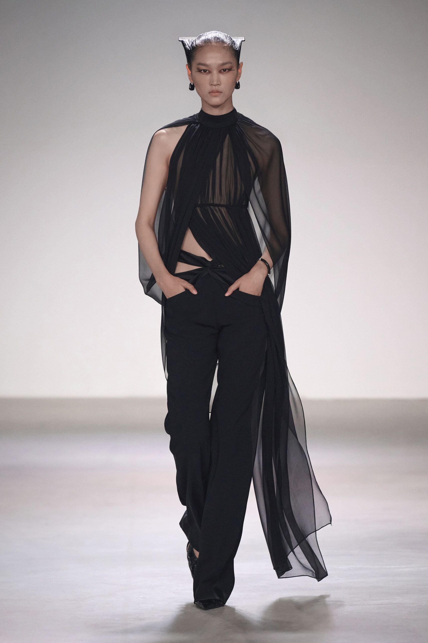 black sheer top and fitted pants