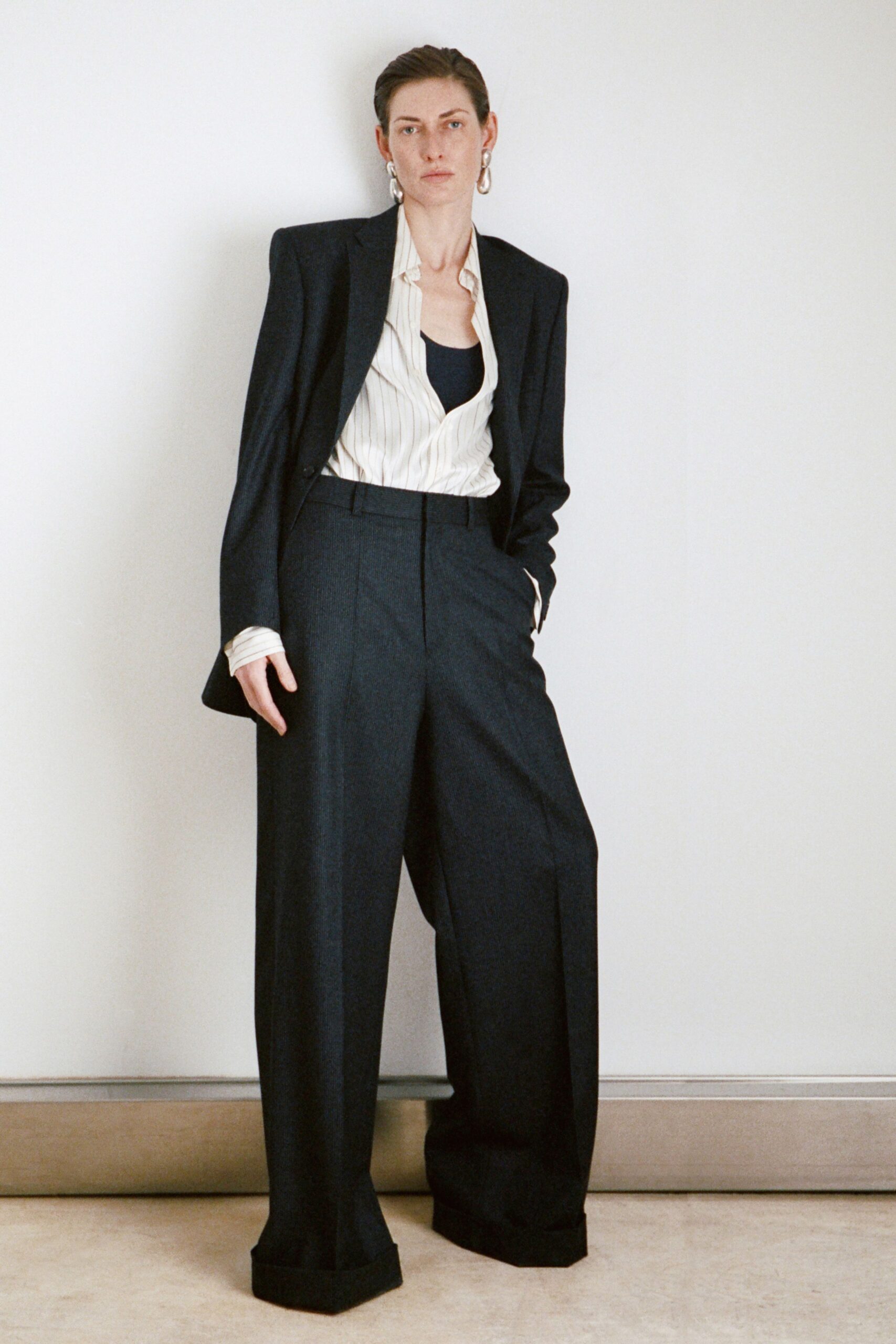 black tailored blazer with striped shirt