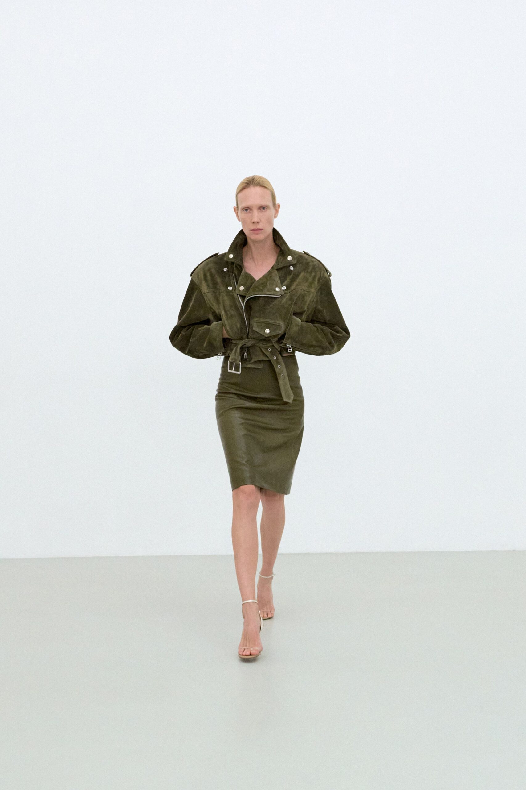 green suede long-sleeve collared fitted zippered belted jacket