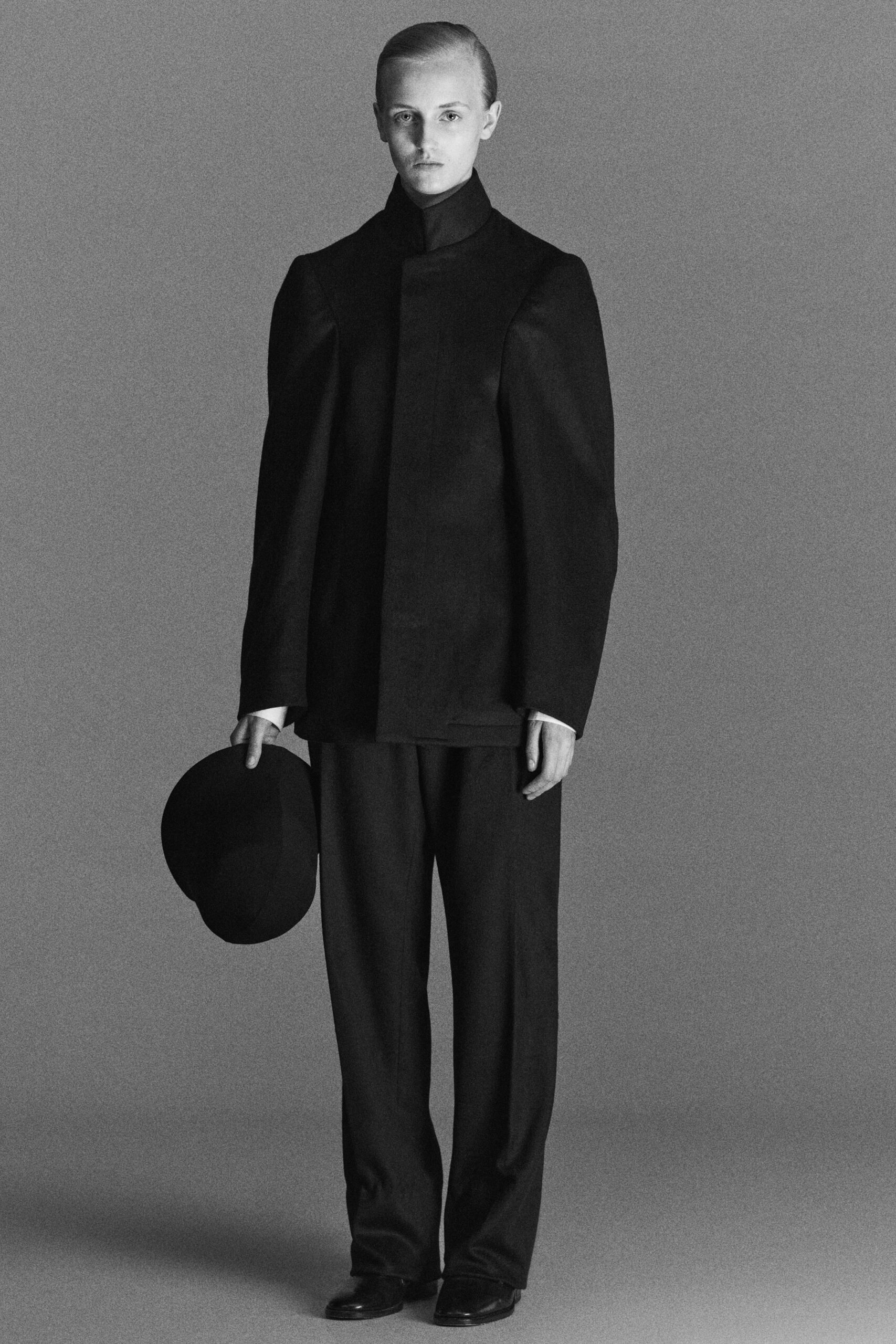 black structured jacket and relaxed pants