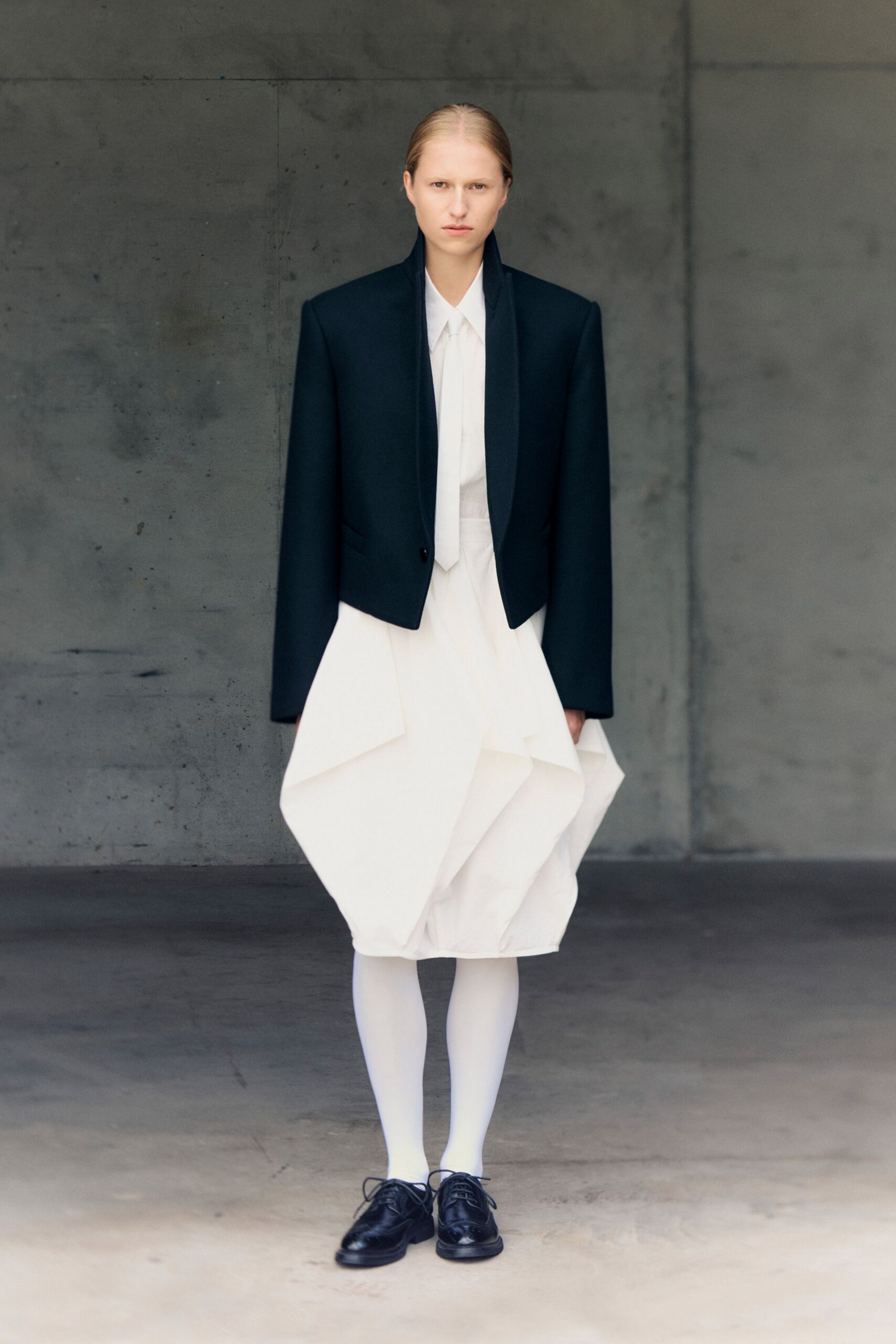 black blazer white pleated dress