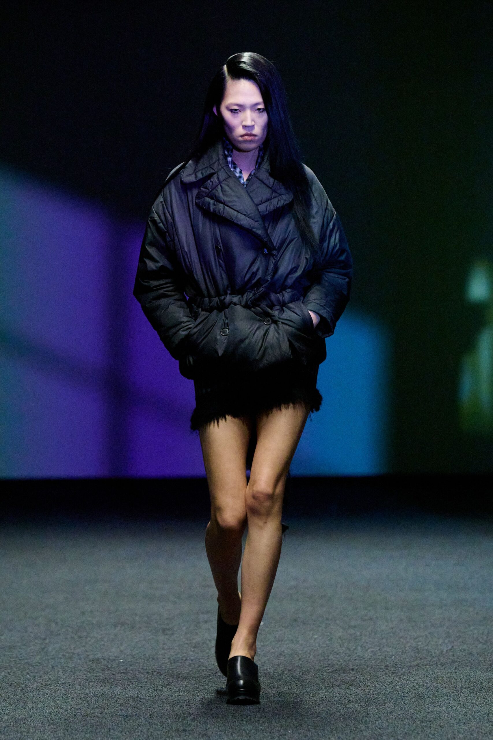 black fitted jacket with fringed shorts
