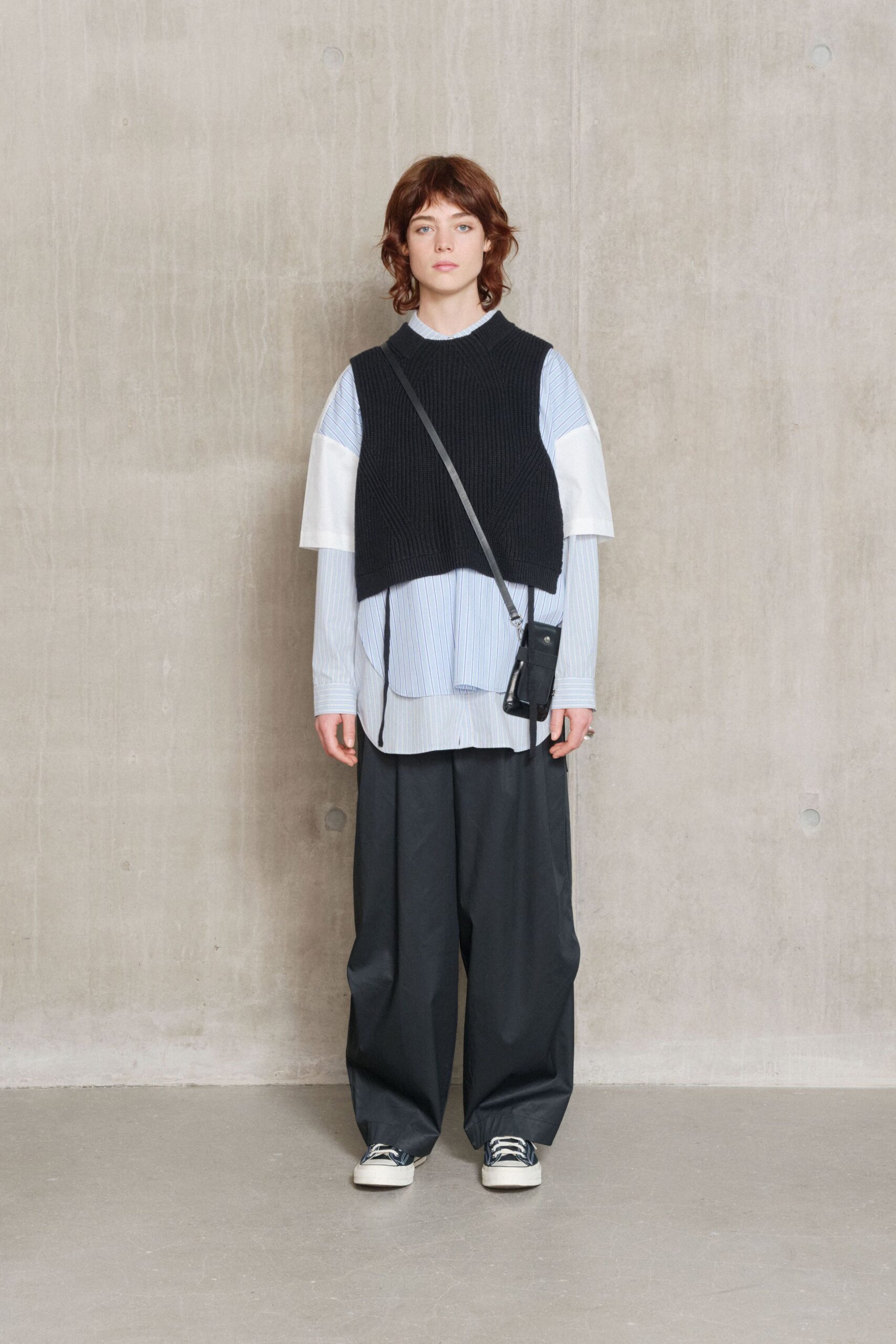 black knit sleeveless fitted vest