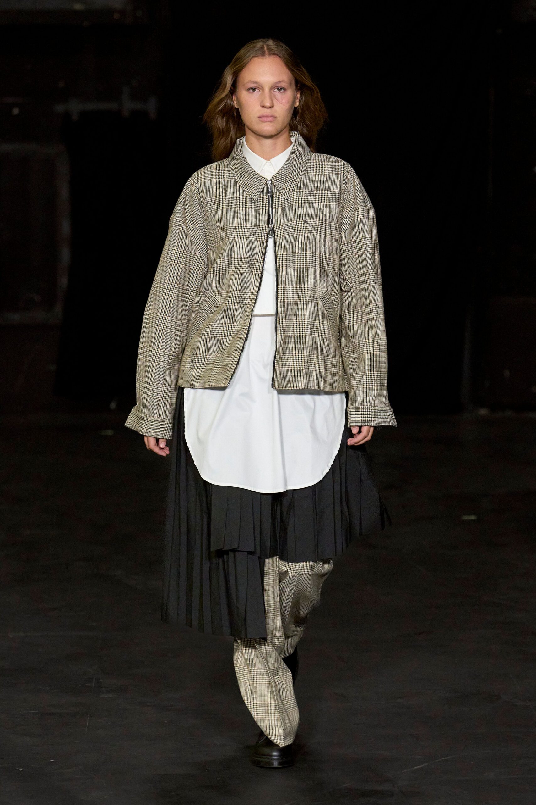 beige checked jacket with black skirt
