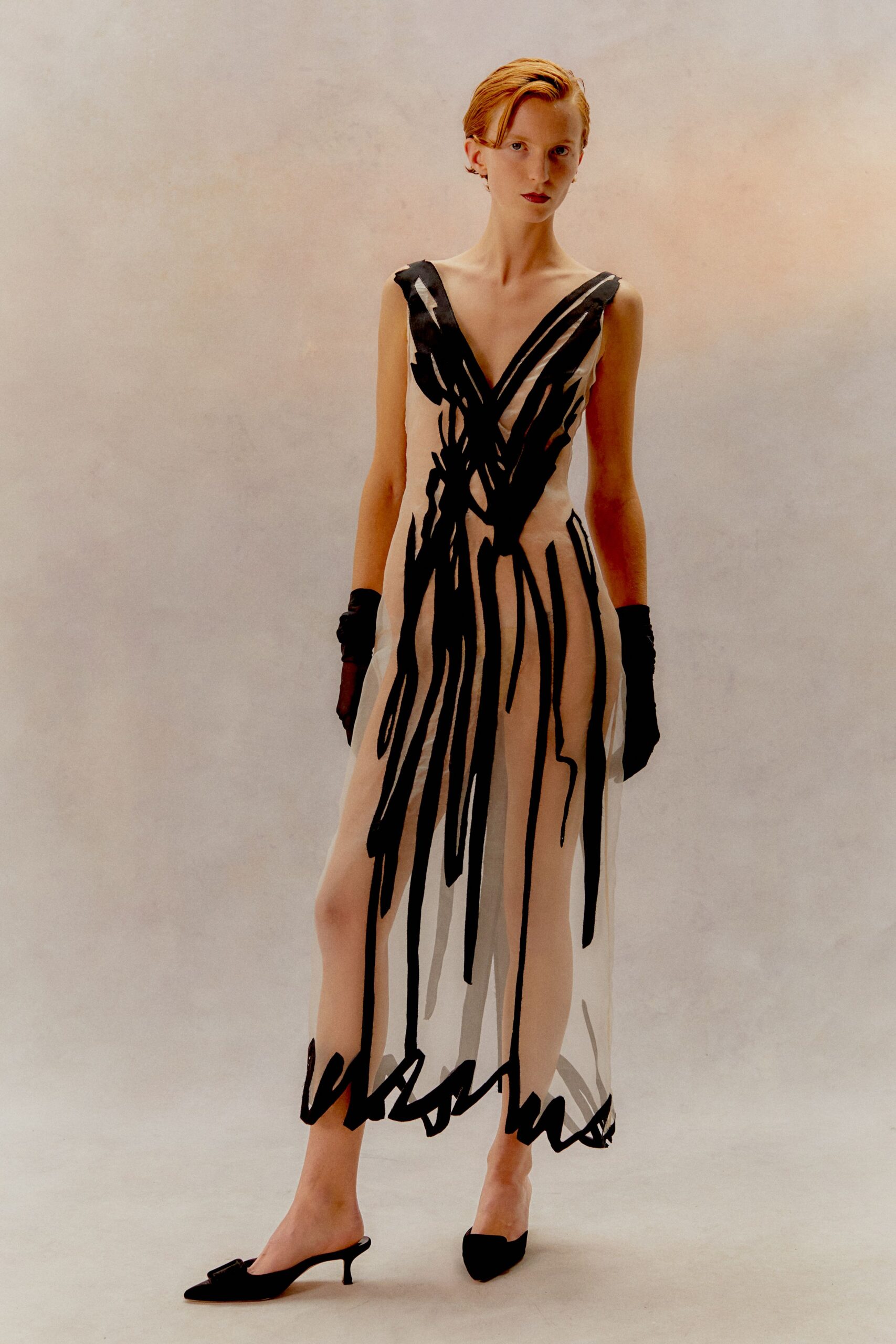 white silk sleeveless v-neck fitted printed sheer gown