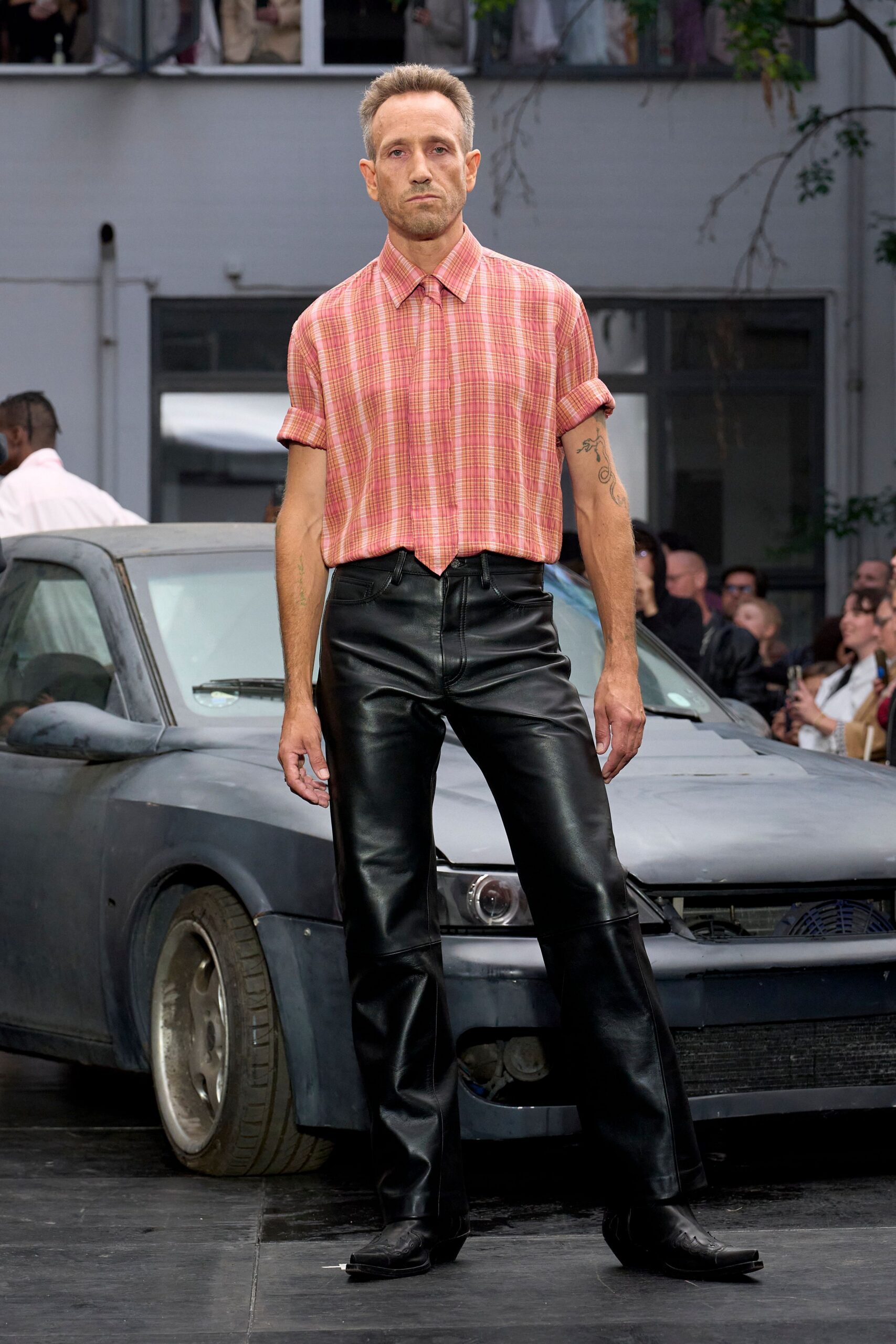pink checked shirt black leather pants