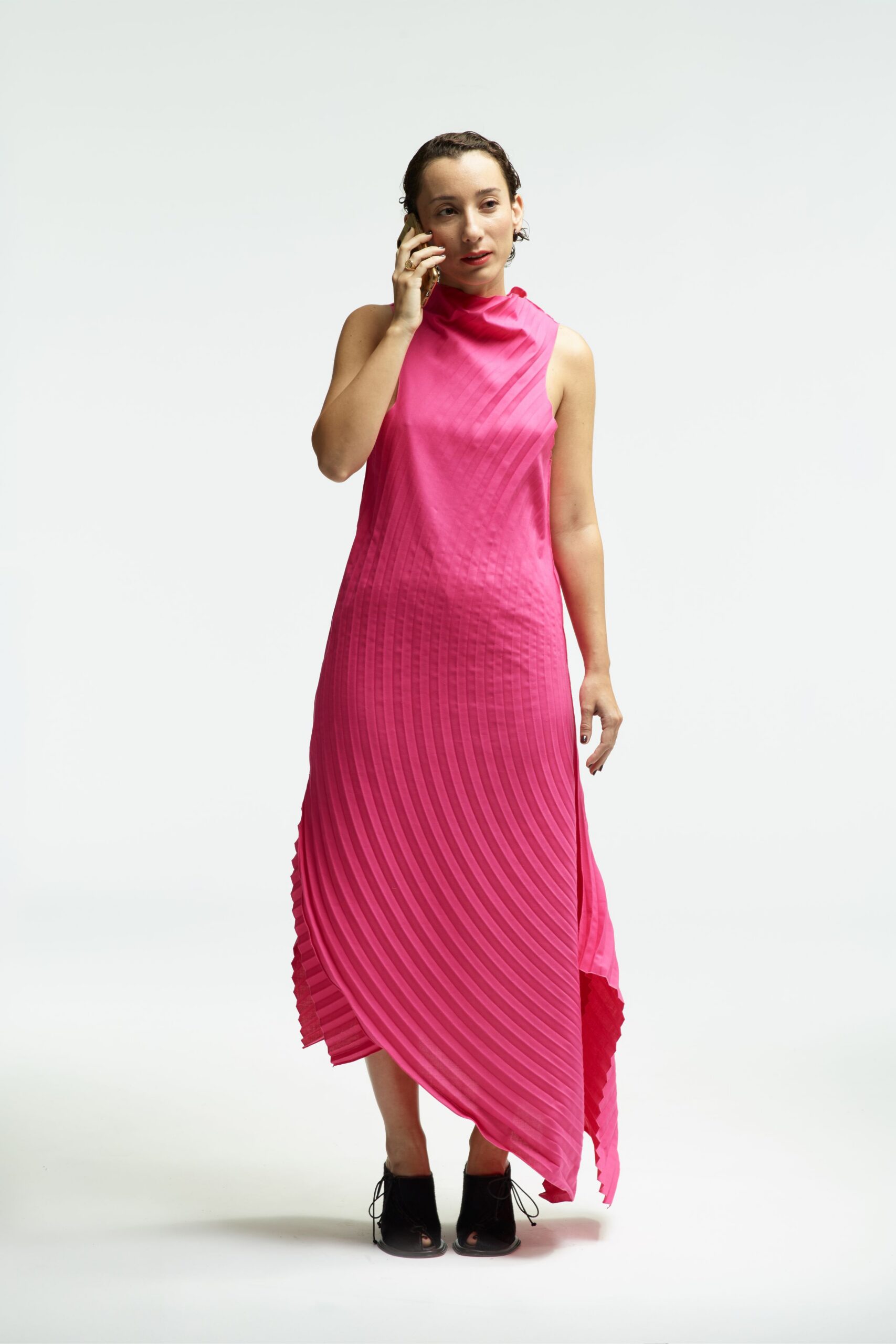 pink silk sleeveless high-neck fitted pleated flowing dress