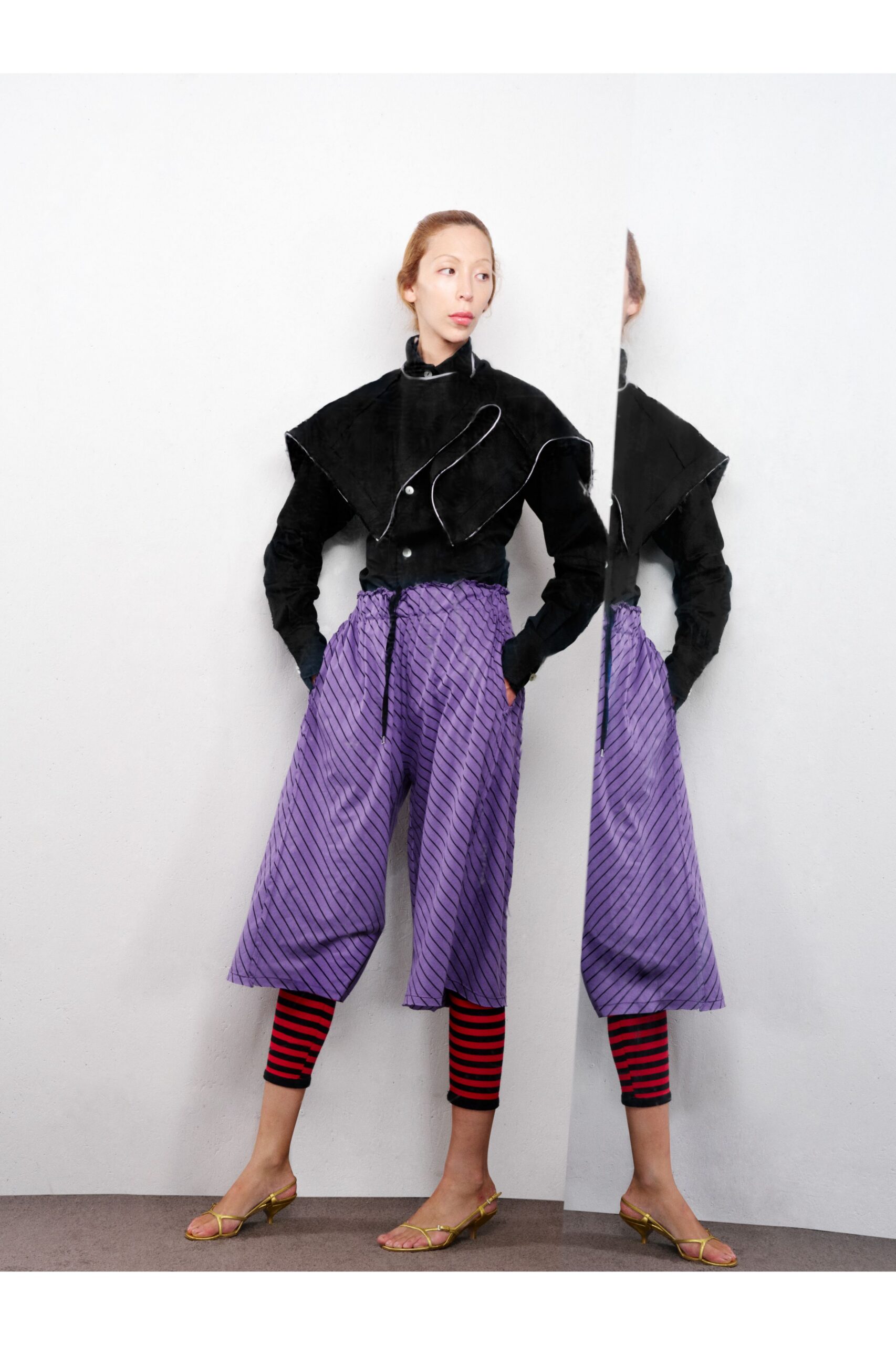 black suede jacket with purple pants