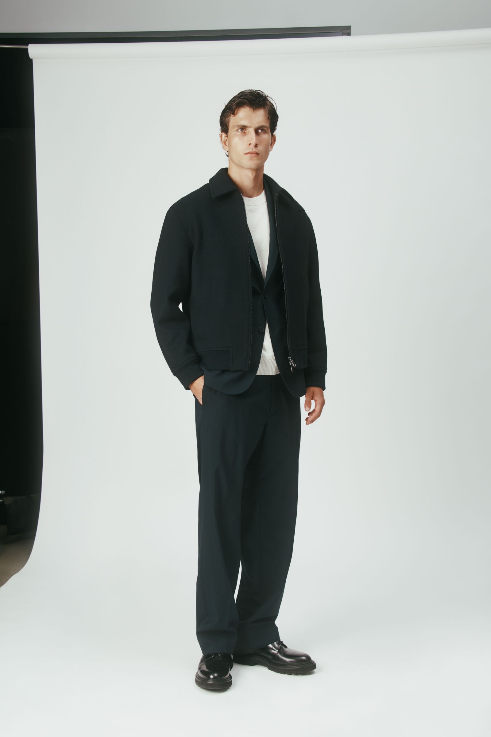 black cotton long-sleeve collared structured zippered jacket