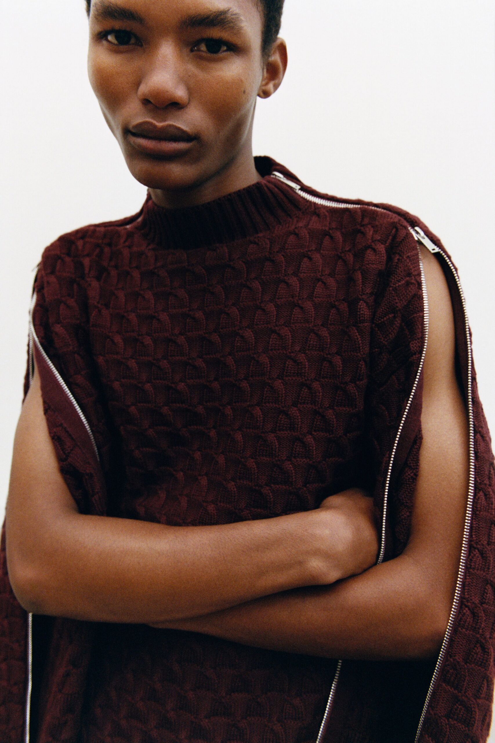 fitted maroon sleeveless sweater